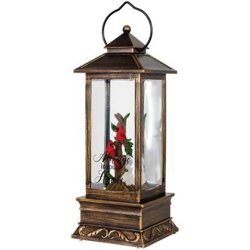 Cardinal Water Glitter Lantern Always In Our Hearts - Our water glitter lanterns are designed with quality and sentiment in mind. The high-quality polyresin lantern features a built-in light and circulator for swirling glitter. The light also features an automatic timer that turns the light on for 6hrs and back off for 18hrs. 3 AAA batteries are included.  W: 4" H: 12" D: 4"