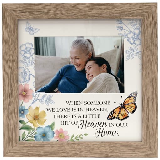 Heaven In Our Home Frame - Our Frames are designed, printed and packaged in the USA! Comprised of wood composite and glass with an easel backing. Cream mat holds a 4 x 6 photo. W: 9.5" H: 9.5" D: 0.75" Inscription reads, "When someone we love is in Heaven, there is a little bit of Heaven in our home."