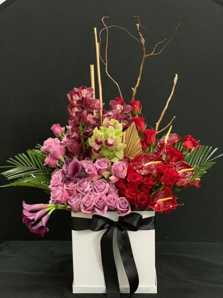 Luxurious Flower Bouquet with Roses, Flamingo Lily, Freesia &amp; Crimson Cattleya - Experience the elegance of a premium flower bouquet featuring roses, flamingo lilies, common freesia, and vibrant crimson cattleya orchids. This stunning arrangement is perfect for anniversaries, celebrations, or as a thoughtful gift. Order today to brighten any occasion!