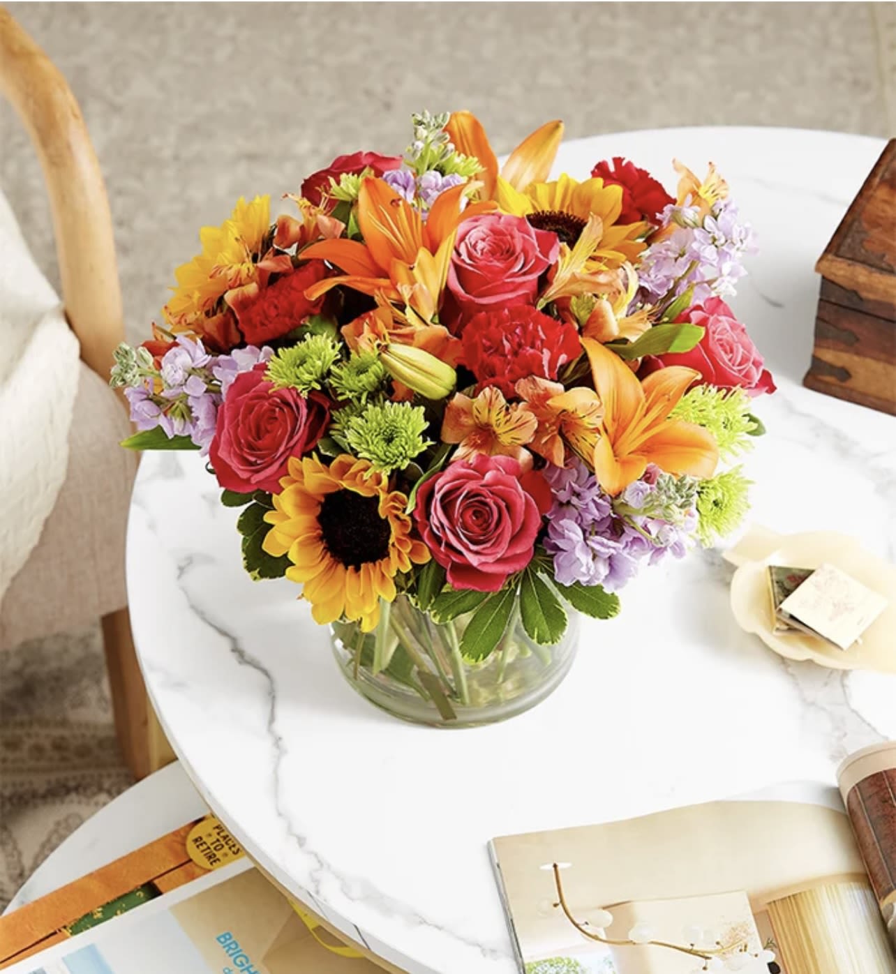 Floral Embrace (8) - Like a warm embrace, our vibrant flower bouquet delivers your sentiments to someone special.   SUBSTITUTION POLICY Always deliver the freshest flowers! Please note the bouquet pictured reflects our original design.  If the exact flowers or container in this arrangement are not available, our local florists will create a beautiful bouquet with the freshest available flowers.