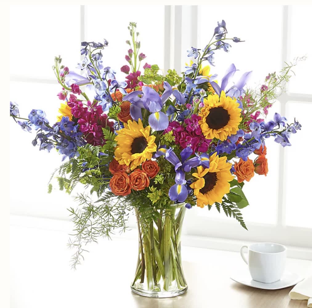 Rays of life (F) - Show your loved ones how much you care with a bouquet full of bright, vibrant summer blooms. This bold bouquet is designed by a local florist, and is best fit for a home or residence.   SUBSTITUTION POLICY Always deliver the freshest flowers! Please note the bouquet pictured reflects our original design.  If the exact flowers or container in this arrangement are not available, our local florists will create a beautiful bouquet with the freshest available flowers.