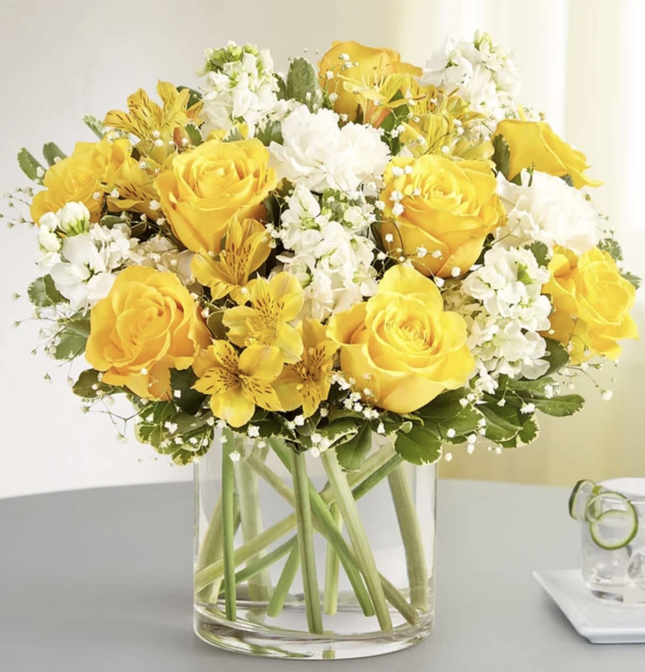 Yellow and white delight  - Full of sunny cheer, our brightly colored bouquet makes the kind of surprise that will leave them smiling.   SUBSTITUTION POLICY Always deliver the freshest flowers! Please note the bouquet pictured reflects our original design.  If the exact flowers or container in this arrangement are not available, our local florists will create a beautiful bouquet with the freshest available flowers.