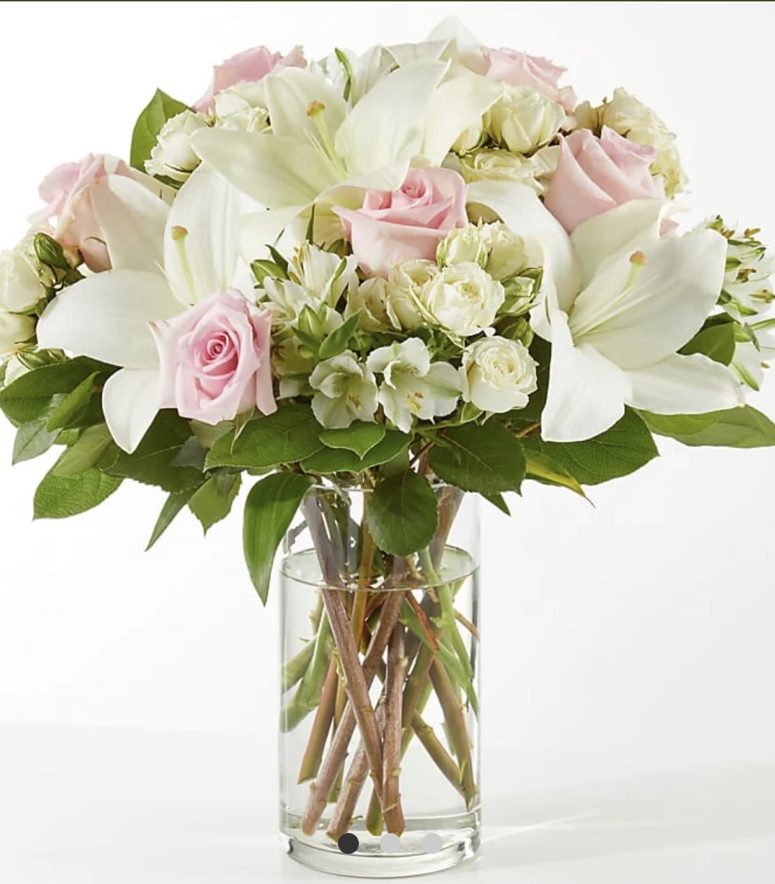 Kind Hearted (F) - The Kindhearted Bouquet is a gentle swirl of pale pink and ivory blooms, the perfect way to share a sweet sentiment with those you hold near and dear.   SUBSTITUTION POLICY Always deliver the freshest flowers! Please note the bouquet pictured reflects our original design.  If the exact flowers or container in this arrangement are not available, our local florists will create a beautiful bouquet with the freshest available flowers.
