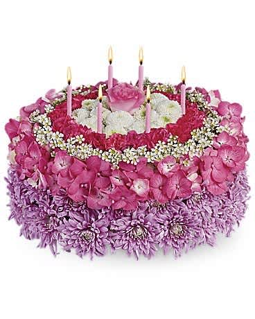 Your Special Day - Tell the birthday girl to make a wish on these candles! Made entirely of fresh flowers, this delightful "cake" will really make her day special. The recipe for this cake includes a pink rose and hydrangea, hot pink miniature carnations, white button spray chrysanthemums and waxflower and lavender cushion spray chrysanthemums. This tasteful arrangement even comes with its own hot pink candles. It's everything a girl could wish for!
