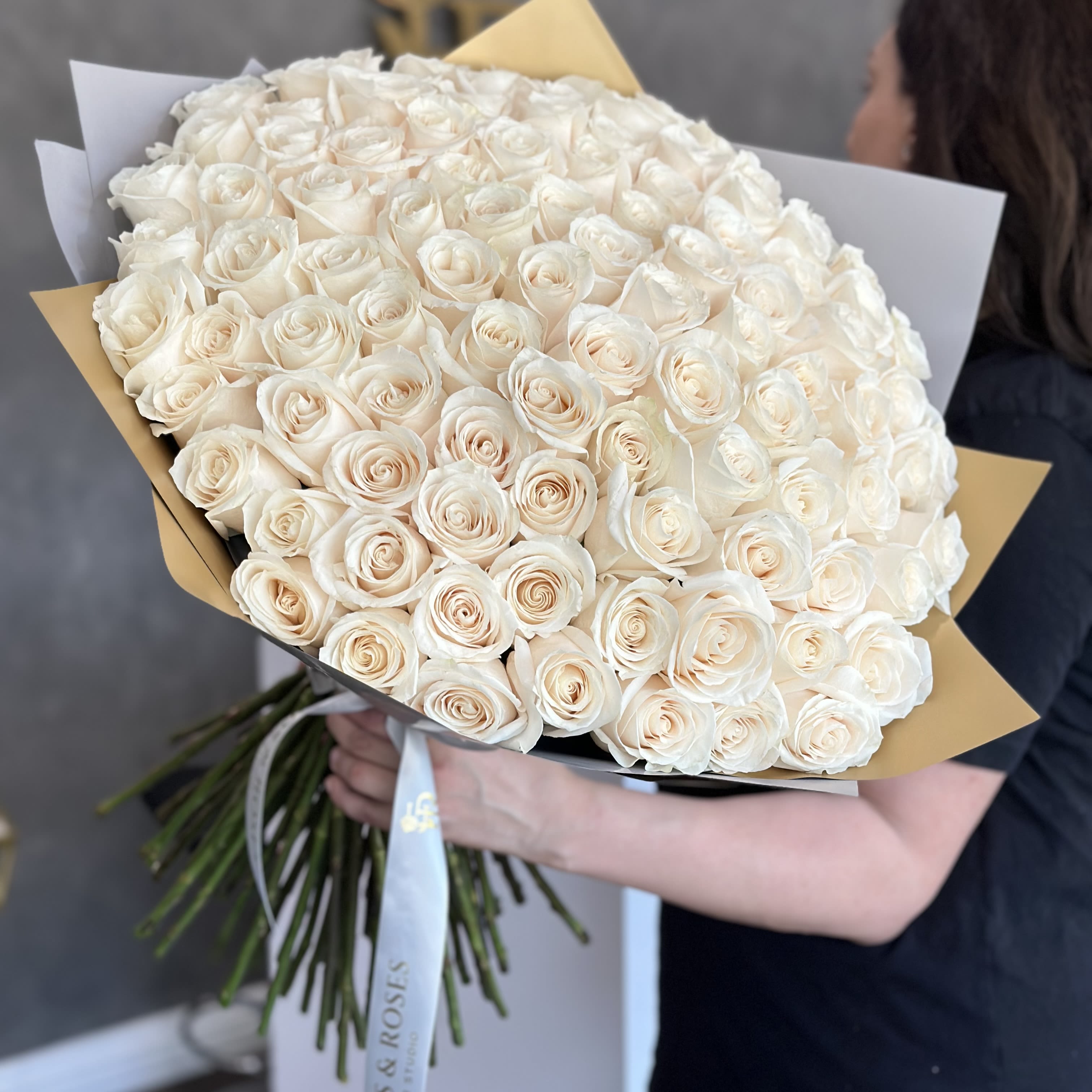 100 white roses - A stunning arrangement of 100 white long stem roses is an ideal gift for any occasion.