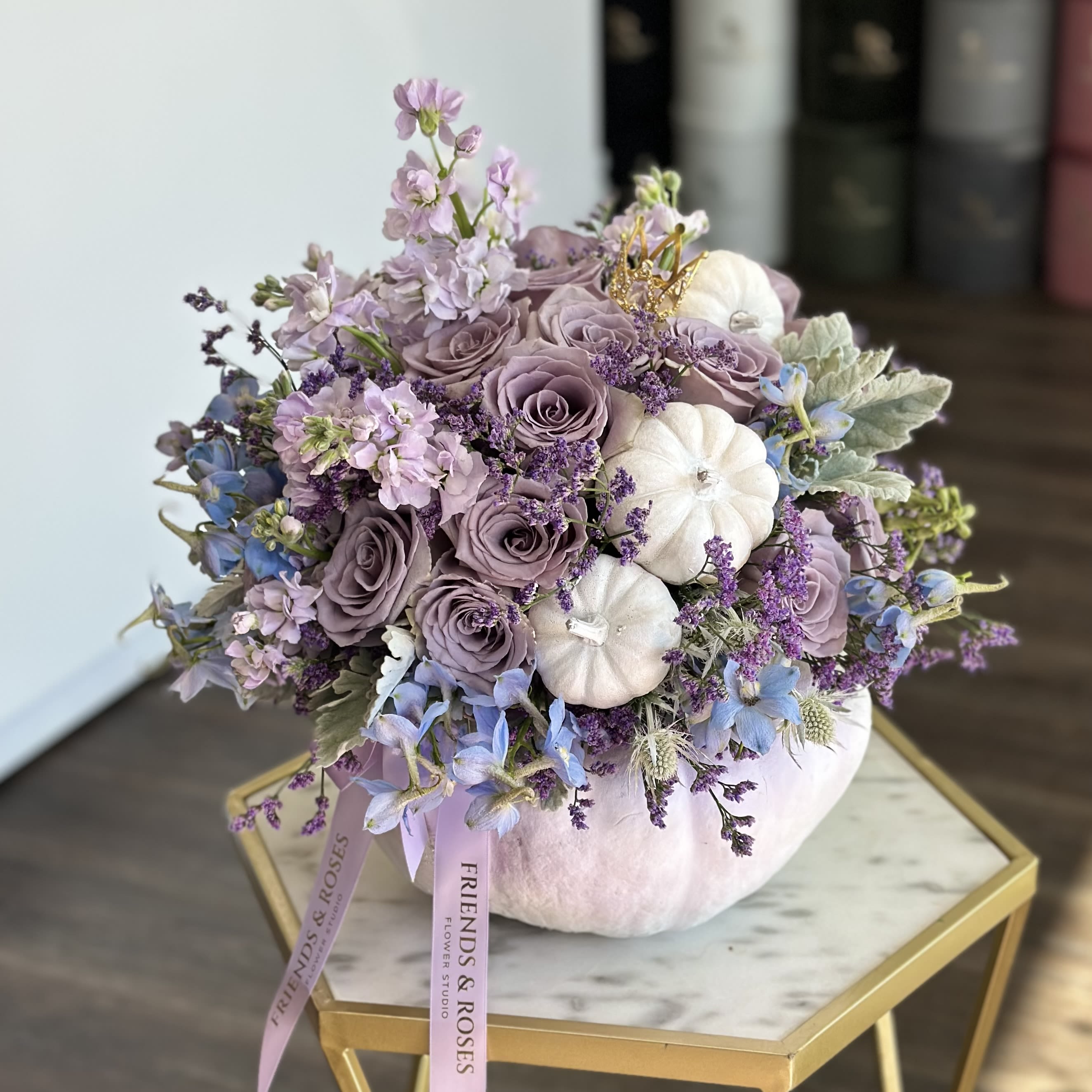 Fairy Tale Pumpkin. - A stunning mix of soft lavender roses, delicate lilac blooms, and pastel blue accents, artfully arranged in charming white pumpkin vase. This elegant composition combines autumn warmth with refined beauty - perfect for gifting, decorating your home, or creating a cozy seasonal atmosphere.