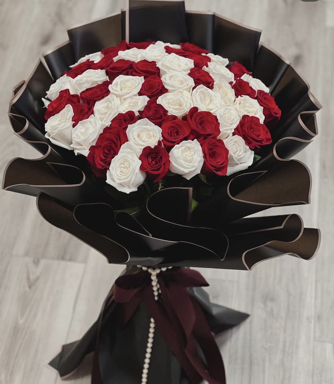 50 classic roses with nice wrapping. - Purchase of this arrangement will also come with a cake - popular choice for romantic relationships 