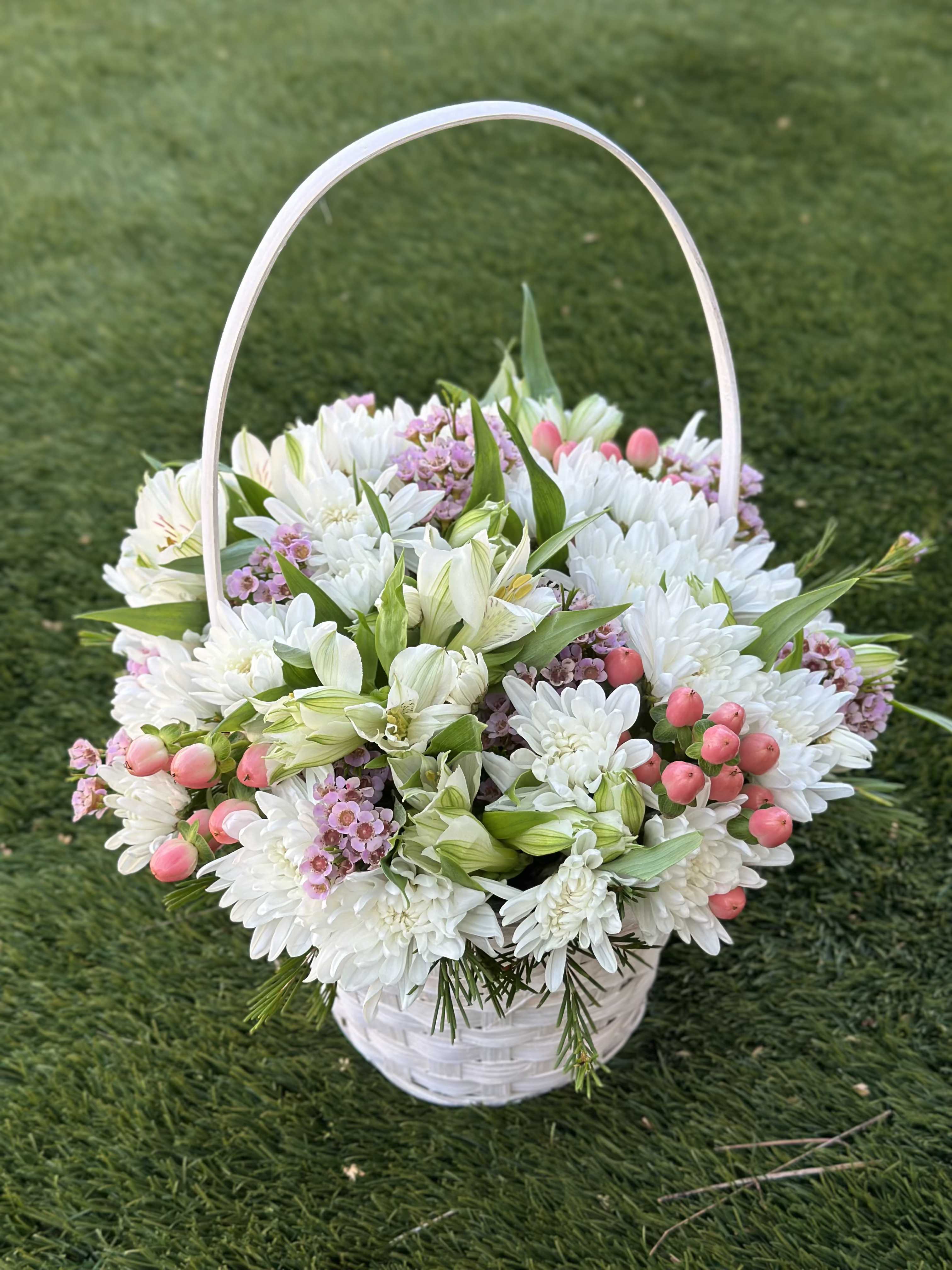Blooming Dream - A miniature basket filled with a soft mix of fresh blooms — the perfect way to gently hint at your feelings or offer a heartfelt compliment to someone special.  Inside this charming arrangement, you’ll find a delicate selection of fresh flowers that will delight the eye and bring joy for days to come.  Light, elegant, and full of warmth, this basket suits any occasion — or none at all. Sometimes, the smallest gesture says the most. When ordering this arrangement, you will receive a composition in soft shades of color. Component substitutions are possible.