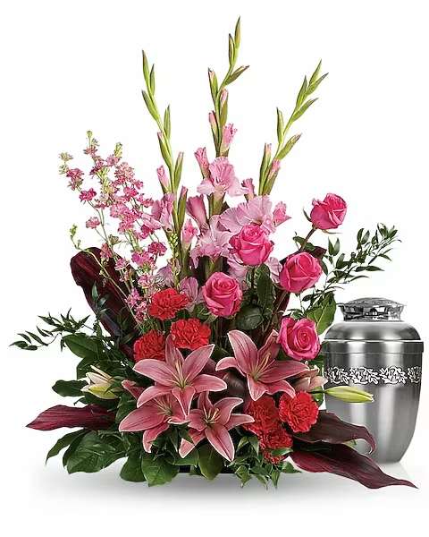 Adoring Heart - Share your heartfelt feelings on the loss of someone special with this feminine arrangement of pink roses, lilies and gladioli. It's a rich reminder of your love at the memorial service. This feminine arrangement features hot pink roses, pink asiatic lilies, pink gladioli, hot pink carnations, pink larkspur, red ti leaves, Italian ruscus and lemon leaf. Arrangement does not include urn.   Orientation : One-Sided  All prices in USD ($)  Due to an increase in the cost of roses, some product prices may be impacted during the Valentine’s delivery period.