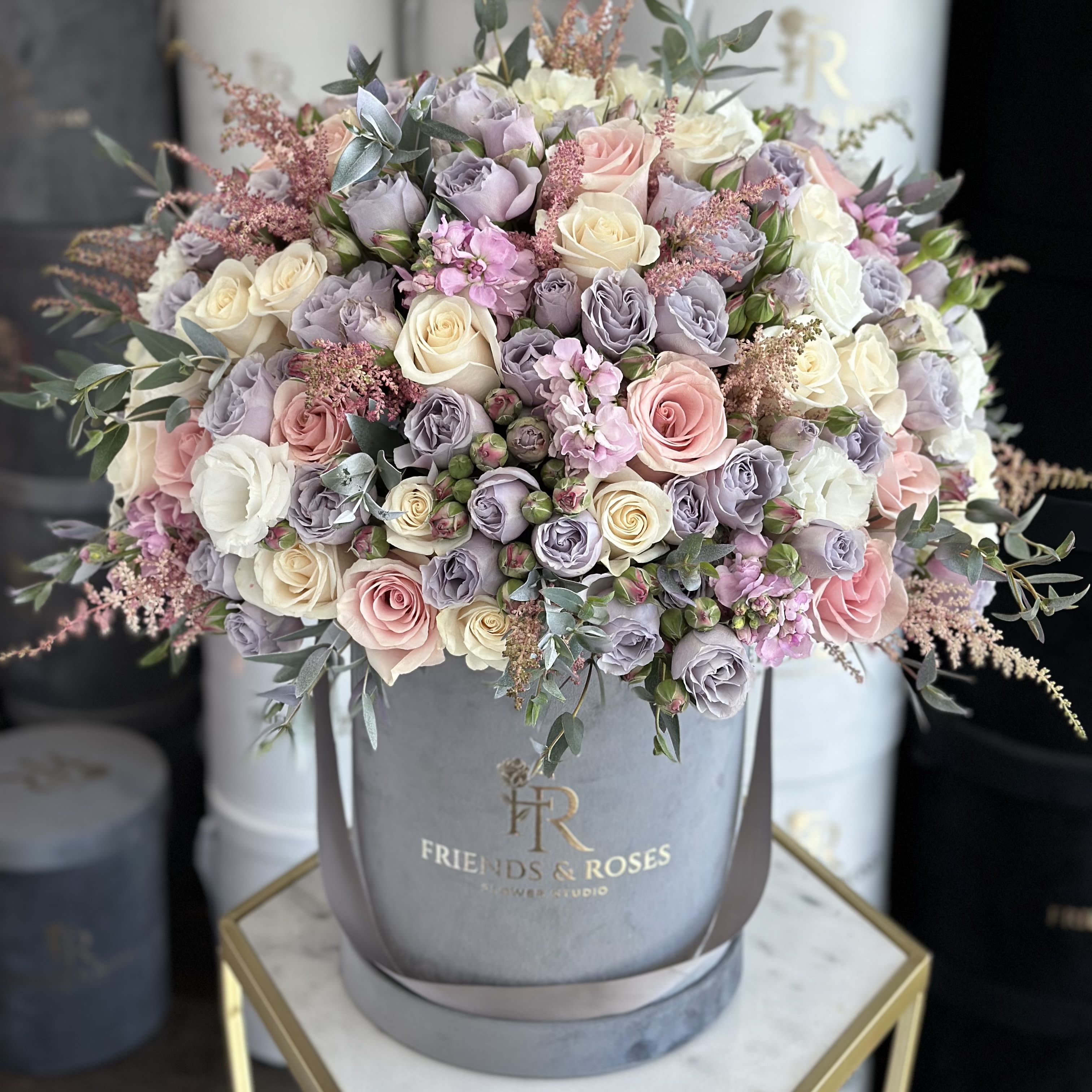 Patricia - A stunning all-around arrangement of fine flowers in our signature grey box will be an unforgettable present for any occasion.