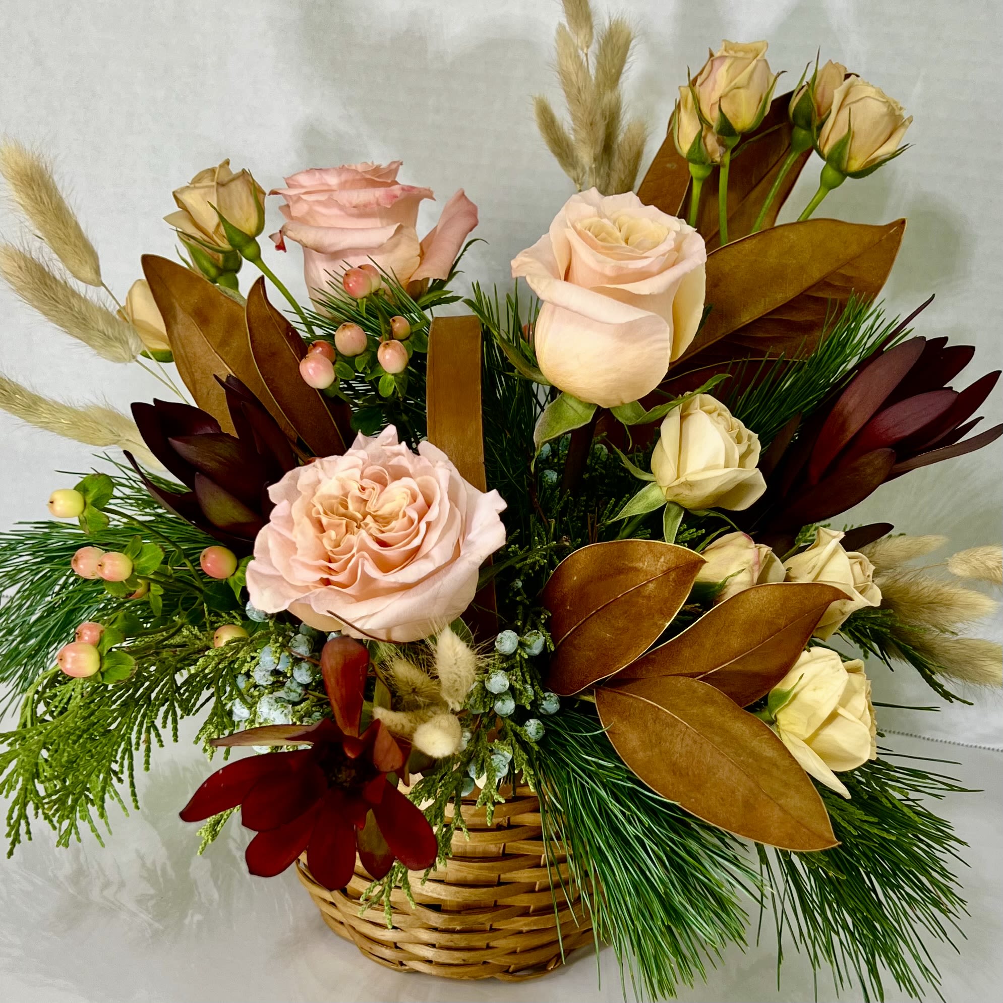 Nathan's Mix - Soothing dried elements accent these peach, brown, and burgundy blooms giving this basket a natural, organic look.  Flowers will vary based on the season.