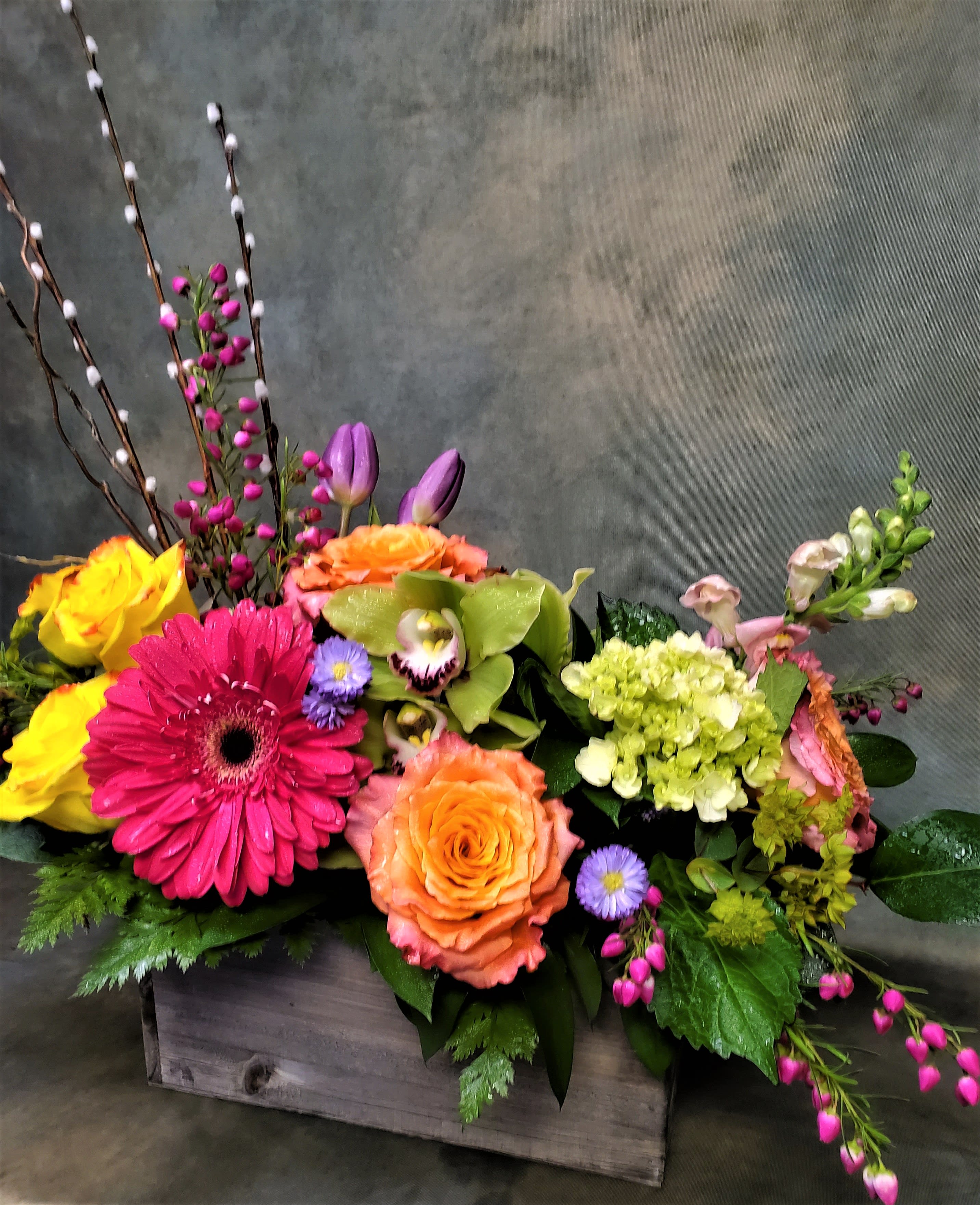 Flower Magic - What is in bloom for spring? This arrangement can have what ever is in stock what is listed is just a few for Spring. Roses, Gerbera Daises,...****flowers and colors may vary*****