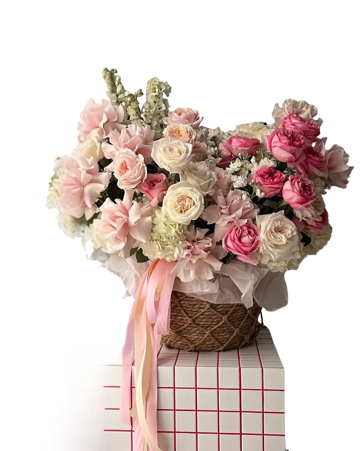 Paris in Pink Basket garden rose basket - A lush, garden-style basket arrangement in soft blush, cream, and hot-pink tones — romantic, airy, and full of texture. Designed with premium blooms (think roses, hydrangea, delicate seasonal florals) and finished with flowing ribbons for that extra “wow” moment. Perfect for birthdays, anniversaries, new baby, or when you want a gift that feels expensive. Includes: premium seasonal blooms in a keepsake basket + ribbon detail