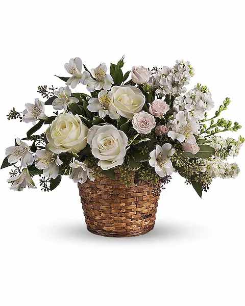 Love's Journey - Your message of caring will be as clear as day when you send this pure white and pretty basket to the bereaved.  A variety of beautiful white flowers such as roses, spray roses, alstroemeria, larkspur and more are lovingly arranged in this tribute.  Approximately 18 1/2" W x 14" H    Orientation : All-Around  All prices in USD ($)  Due to an increase in the cost of roses, some product prices may be impacted during the Valentine’s delivery period.