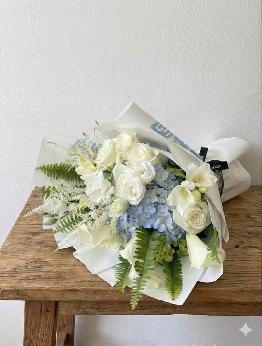 Breeze - This bouquet features white and soft blue colors. 