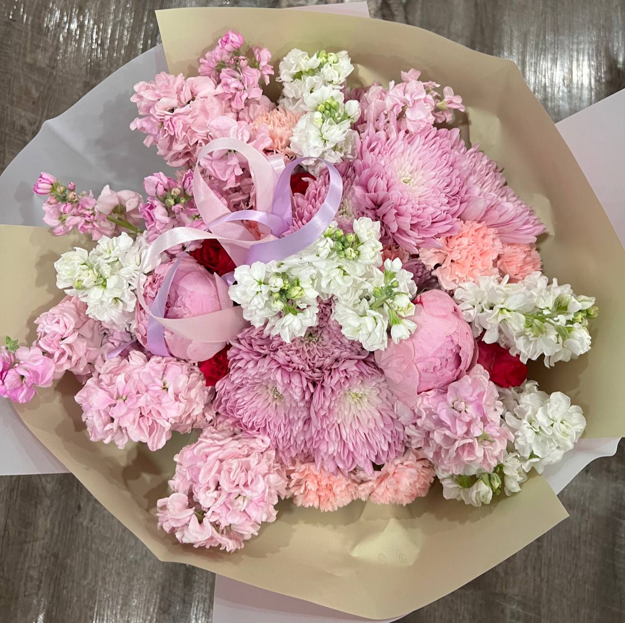 Velvet Tenderness - Bouquet “Velvet Tenderness” – a refined blend of softness and depth. Delicate pink chrysanthemums, airy matthiola, and elegant carnations create a sense of lightness and romance, while the striking dark rose adds a touch of mystery and passion. This bouquet embodies both tenderness and elegance, making it a perfect gift for special occasions.  Ideal for those who appreciate beauty, deep emotions, and sophistication!