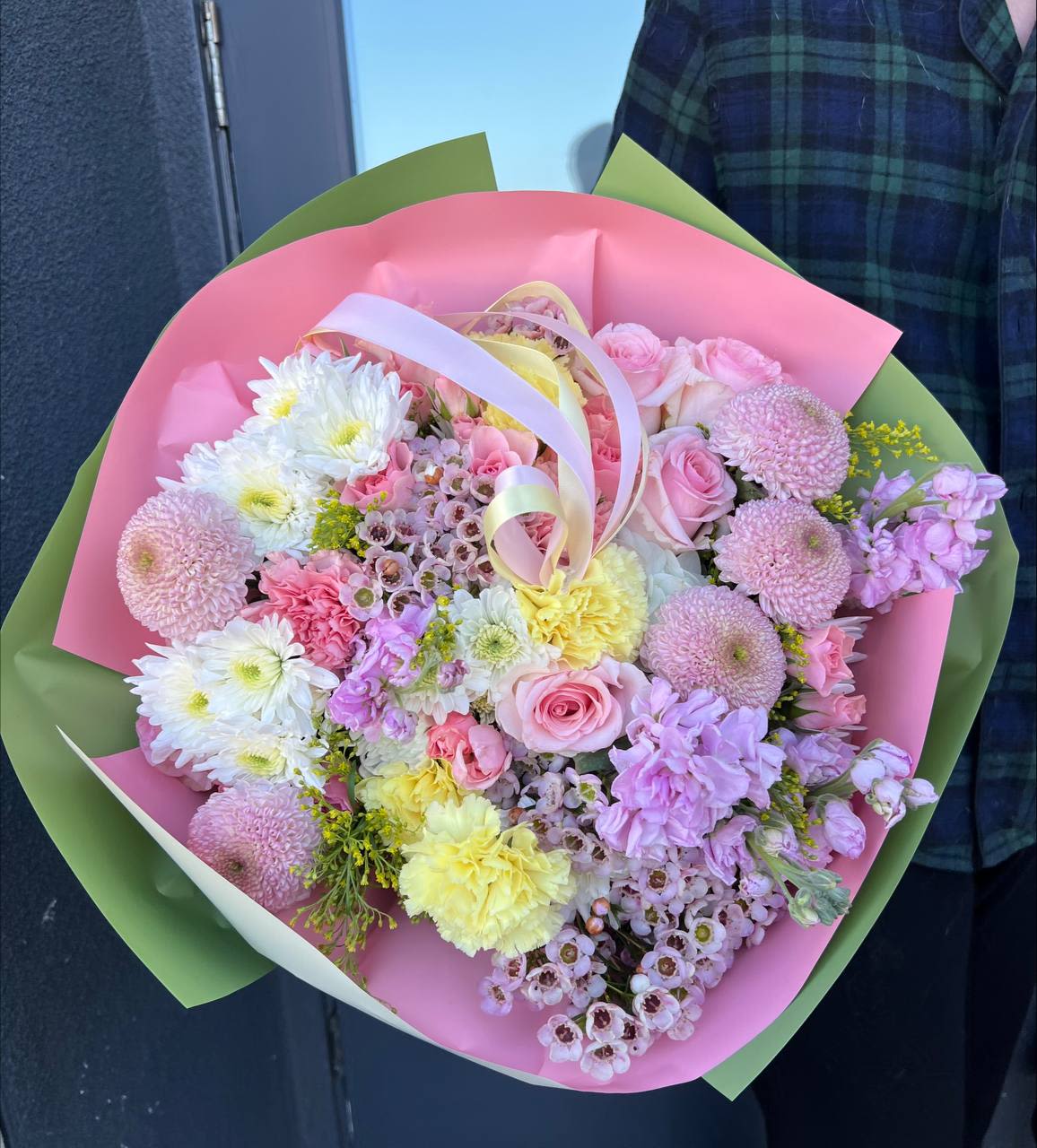 Warm Tenderness - Warm Tenderness is a bouquet filled with softness, warmth, and elegance. The delicate pastel shades of pink, cream, and lavender create a feeling of lightness and airiness, like the gentle rays of the morning sun.  This arrangement combines elegant roses, charming chrysanthemums, romantic stocks, and delicate wax flowers, complemented by fresh greenery accents. It feels like an embrace—gentle, comforting, and full of care.