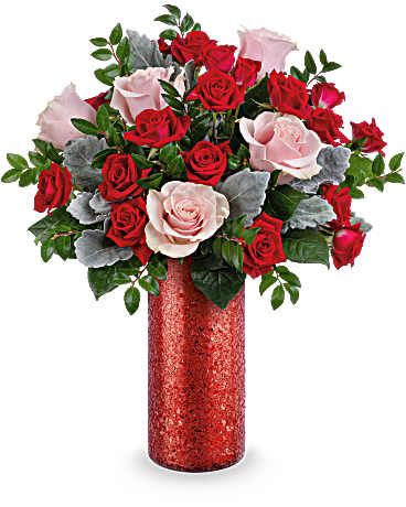 XO Roses - Red Shimmering textured tall glass vase filled with Pink roses and red spray roses with greens.