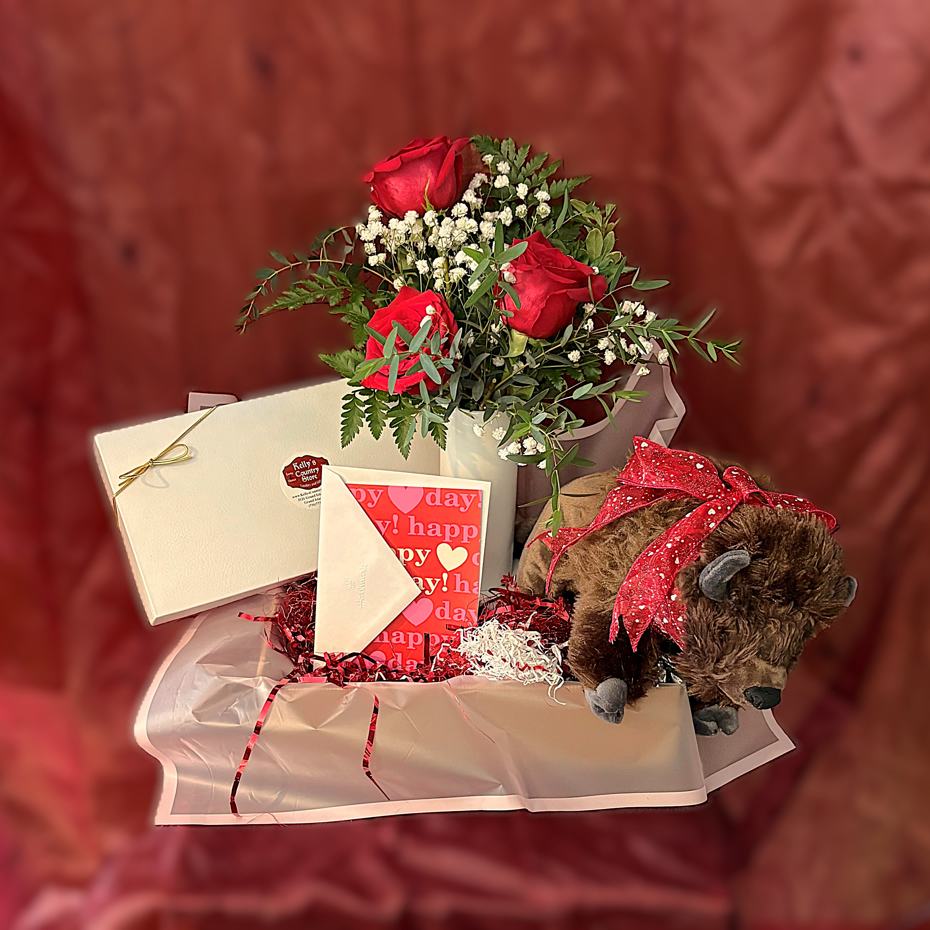 BuffaLuv - PREORDER - All the Valentine's Day favorites in one box, with a special Buffalo flair!  3 classic red roses in a white ceramic vase, a cuddly Buffalo plush friend, 1lb box of assorted Kelly's chocolates, and a full size Valentine's Day card. A charming mix of sweetness and sentiment, perfect for making hearts smile.  Available for delivery after 02/06/2026. 