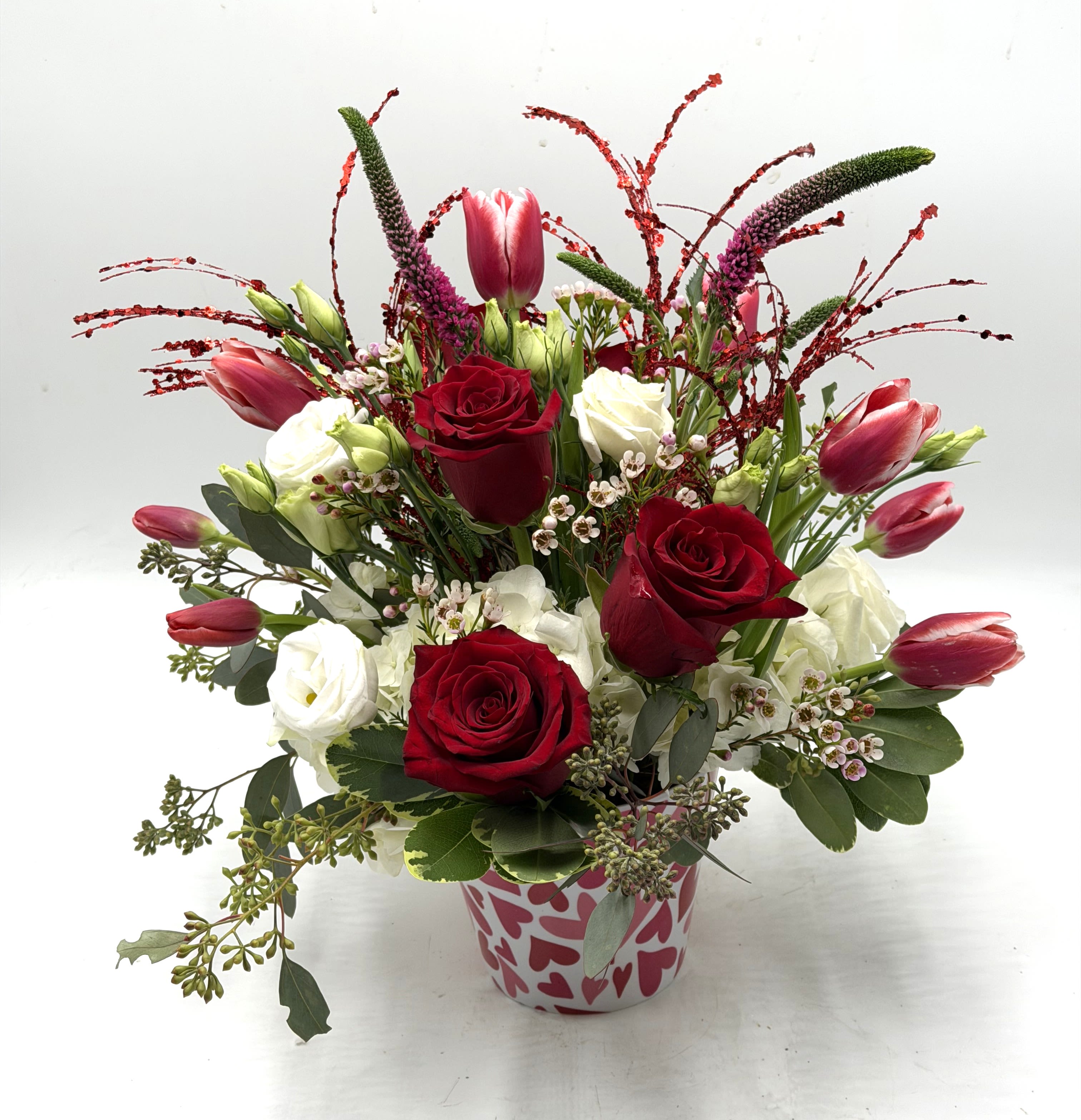 My Modern Valentine - A contemporary take on Valentine's florals, this arrangement features vibrant red roses, pink tulips, white hydrangea and more! Stylish, bold &amp; unforgettable!!
