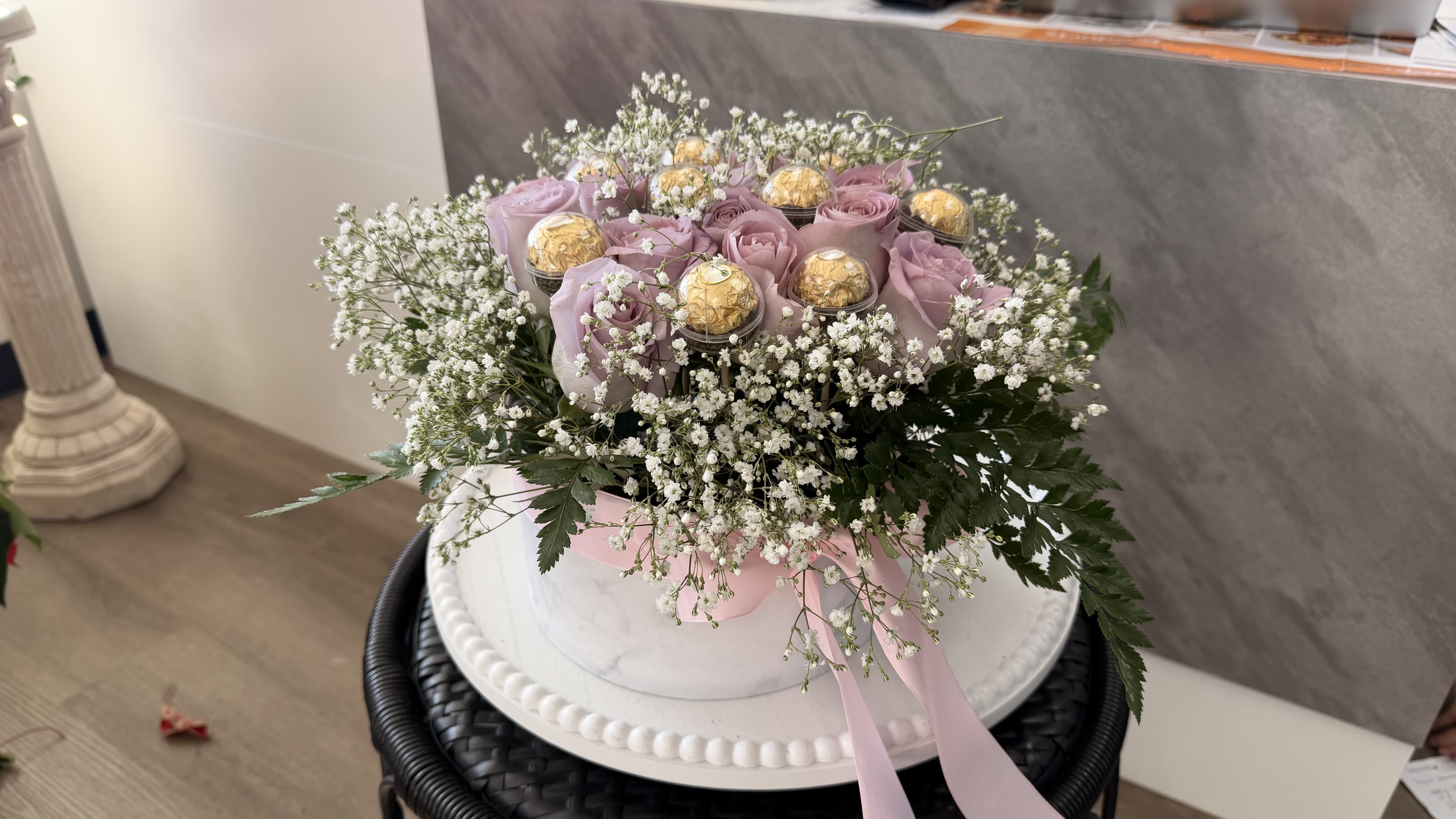 	Lavender Luxe Delight - Soft lavender roses symbolize grace and admiration, paired with airy baby’s breath and rich Ferrero Rocher chocolates for a sweet surprise. This romantic arrangement is thoughtfully designed to express love, appreciation, and heartfelt moments.