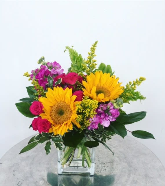 Flower Fields - This fresh, out of the garden look is filled with seasonal greens and bright flowers that are sure to brighten anyone's day. 