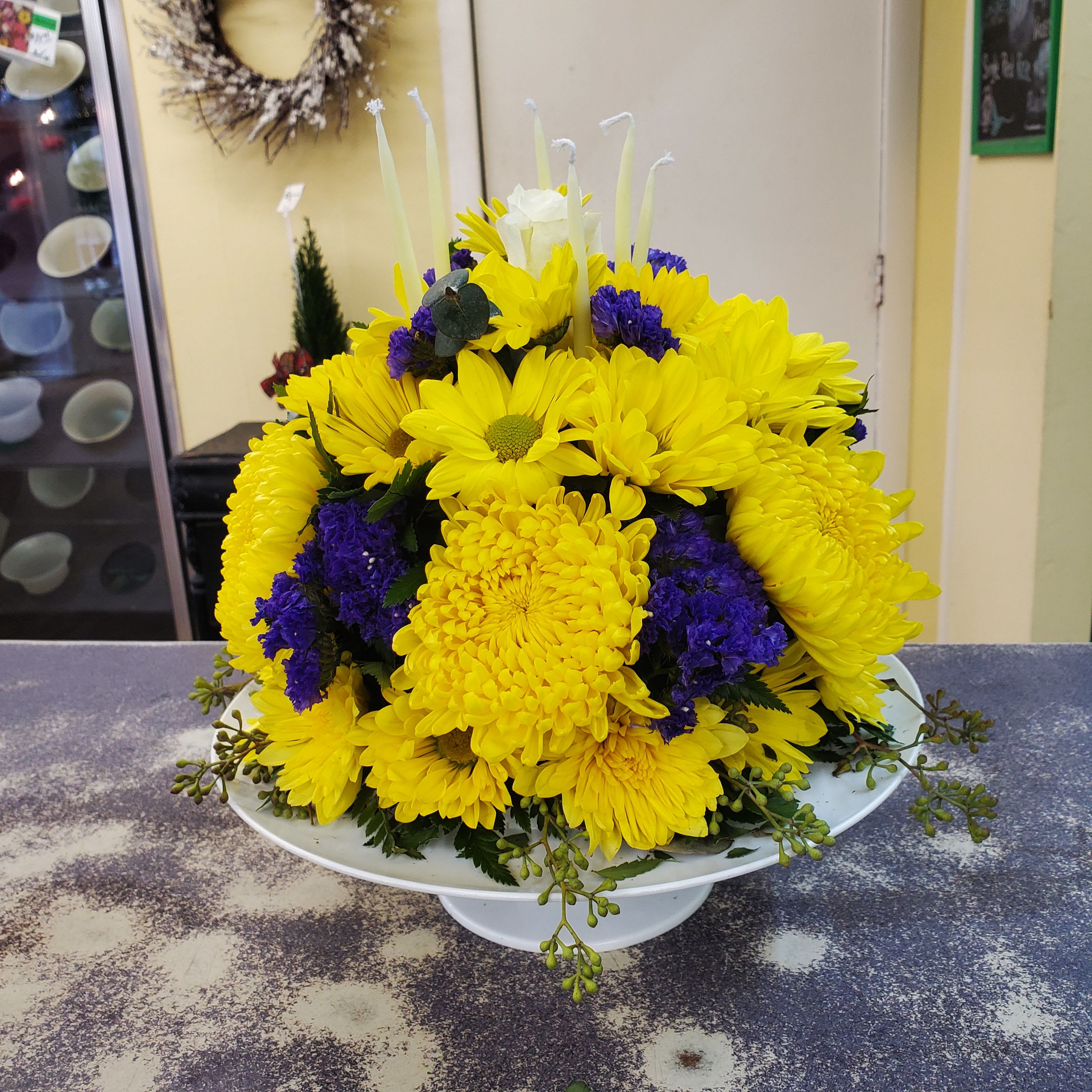 Birthday Cake  - A birthday cake made out of fresh flowers.  On plastic cake stand with candles. Suitable for all celebrating a birthday. 