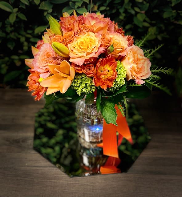 Pumpkin Spice by Donya's Florals, St Augustine Flowers - Pumpkin Spice Centerpiece is an orange fusion of gorgeous florals, great for the one who adores warm, tropical tones and earthy, rich textures this time of year. 