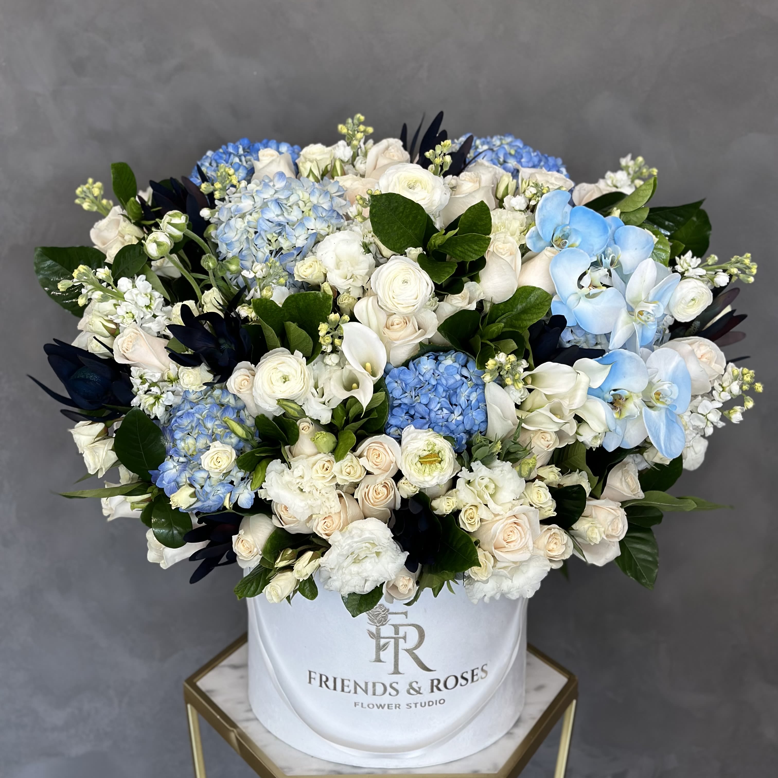 Sapphire - A stunning bouquet of bold, contrasting colors that capture attention this arrangement is perfect for making a statement at any event.