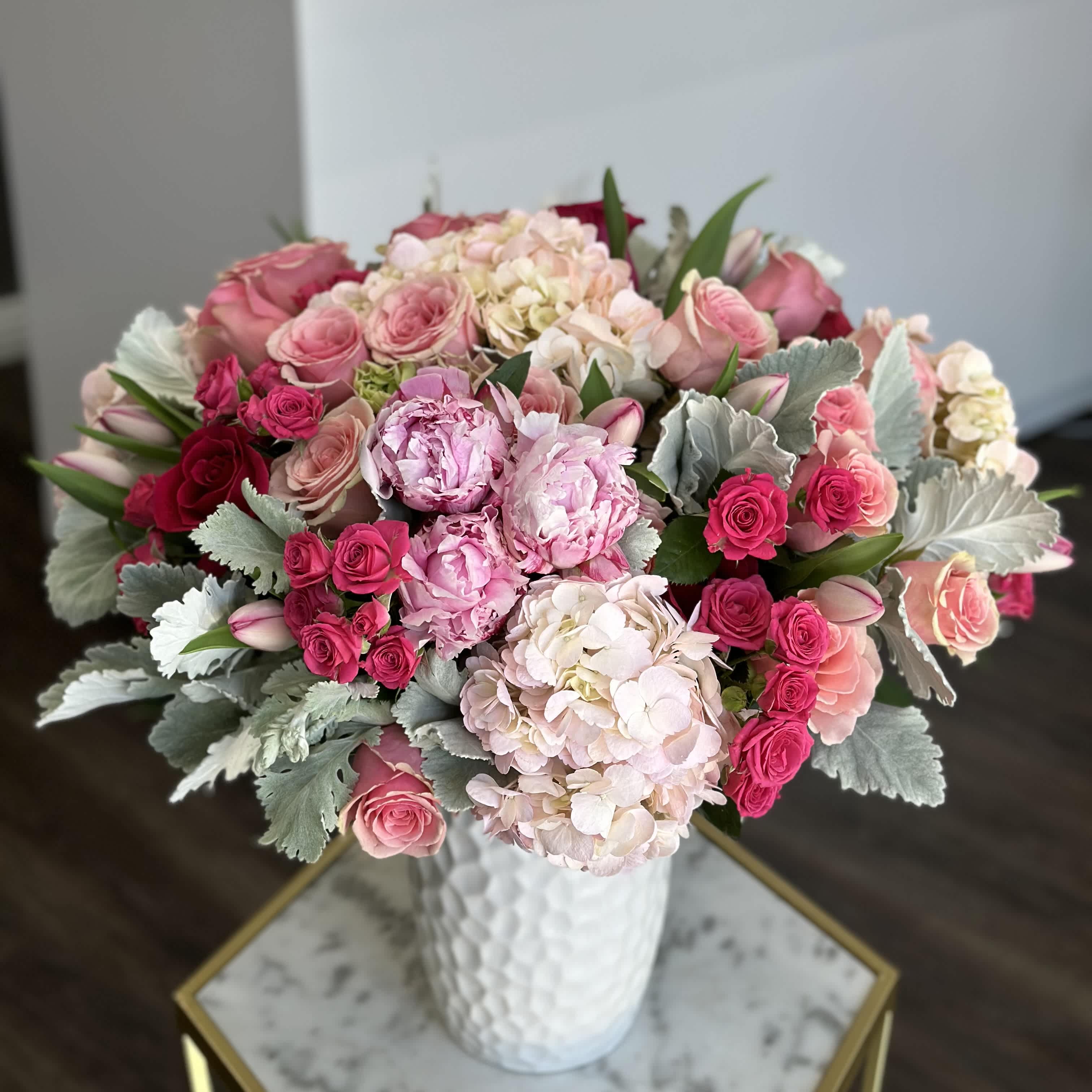 Spring Blooms  - A gorgeous arrangement of mixed premium spring flowers in a vase makes an excellent present for any occasion or home decor.