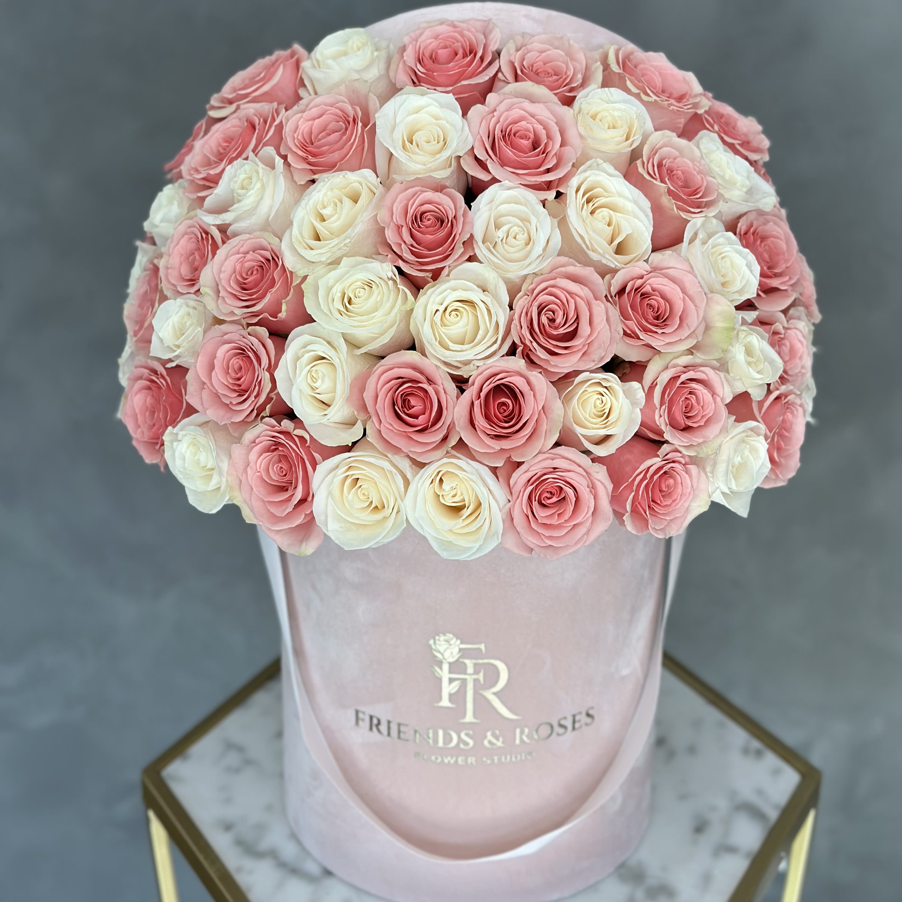 Sweet Dream - A graceful bouquet of soft white and blush pink roses, elegantly arranged in a delicate pink box, perfect for expressing love, gratitude, or any special occasion.