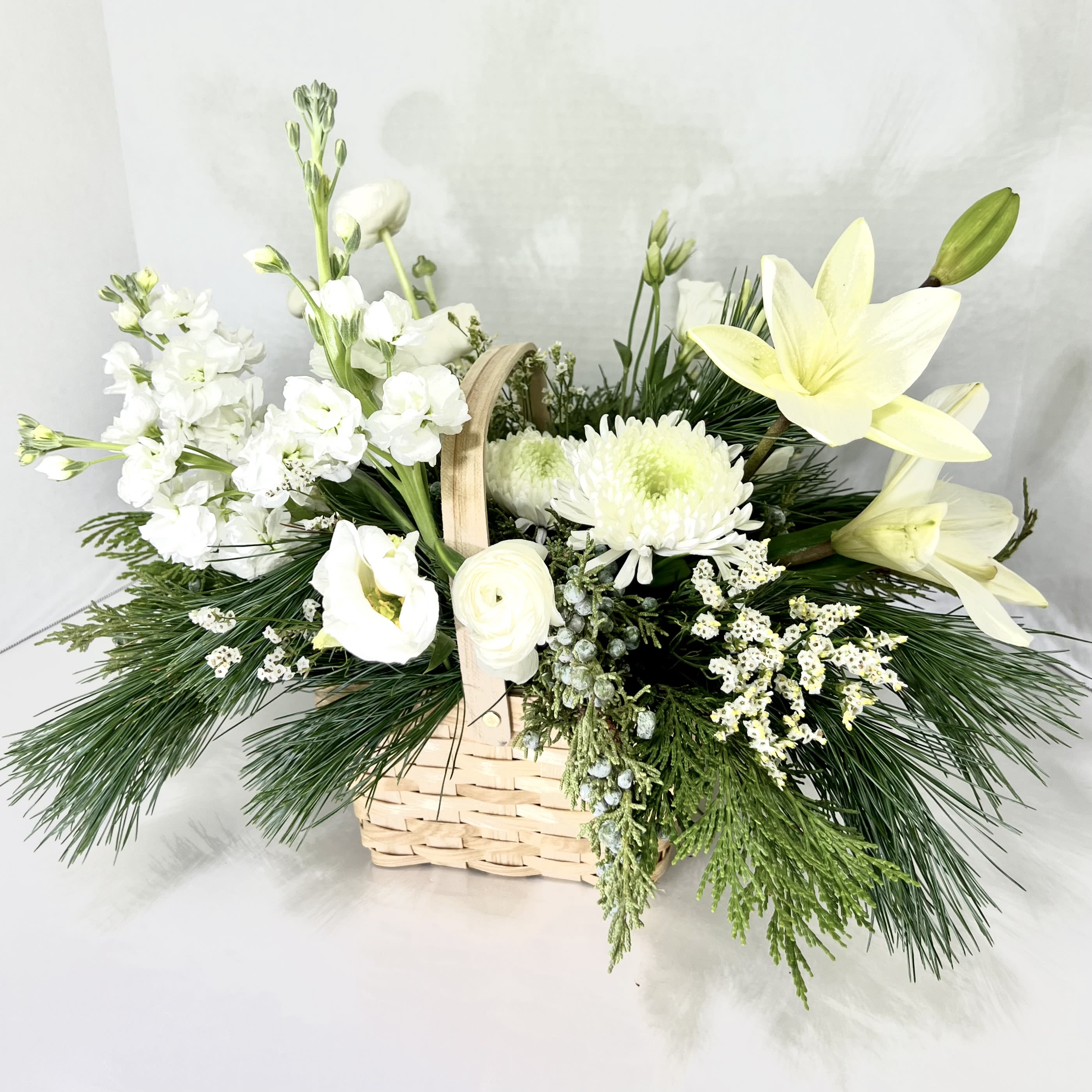 Basket of Blooms - Designer's Choice in a basket is a great choice for any occasion.  Soothing all white flowers or a beautiful mix of colors makes a cheerful gift for any occasion.