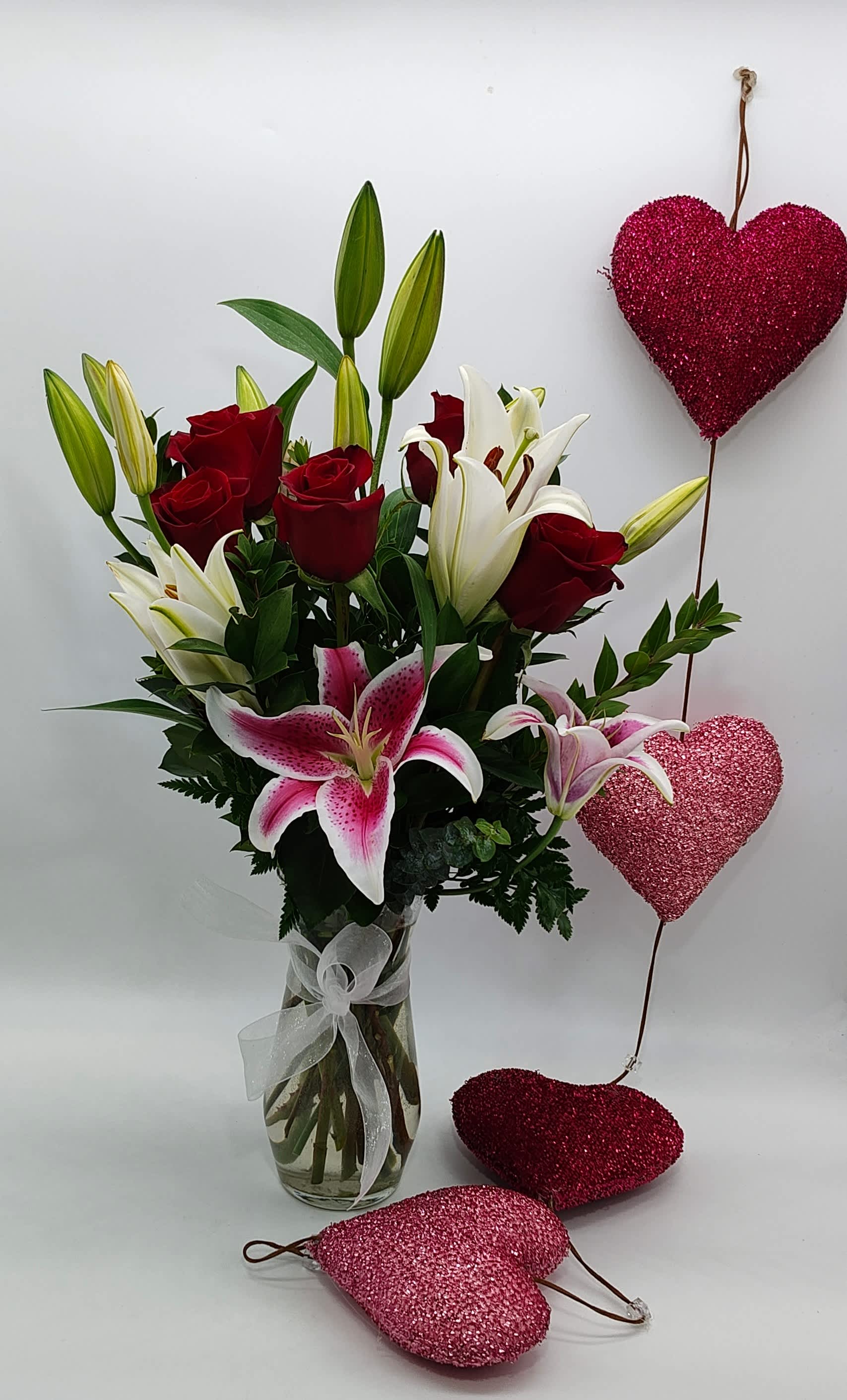 Lily Garden Bouquet  - The ultimate expression of your love. 12 incredible red roses and blooms of fragrant oriental lilies.  Approximately 28 inches tall. 