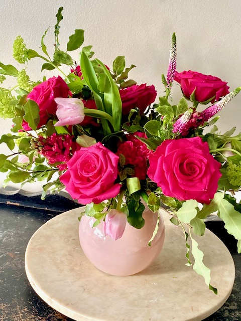 Valentine's Day Collection - Fuchsia Charmer - Blush glass premium vase of hot pink blooms: roses, hyacinth, carnations; pale pink tulips, lime green vibernum and english garden inspired foliages.