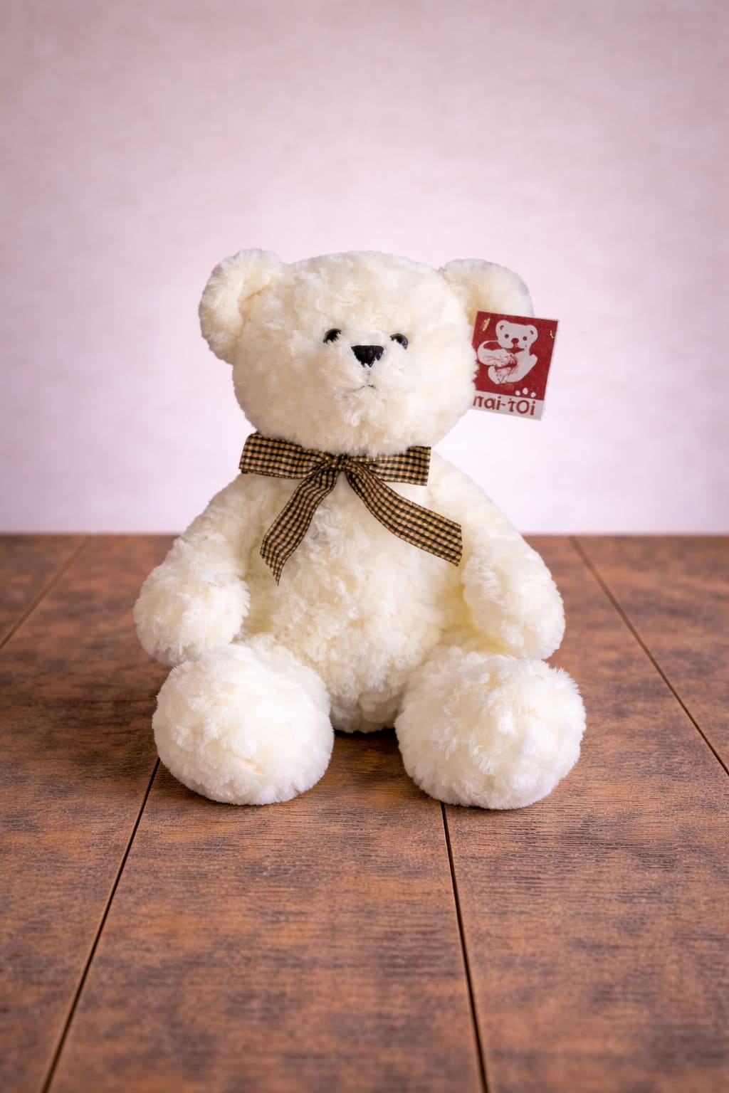 Bear with Bow  - This adorable bear stuffed animal is the perfect blend of classic charm and cozy cuddles! Made from ultra-soft plush fabric, this lovable bear comes in brown or cream features a cute gingham bow tied around its neck, adding a timeless and stylish touch. Whether as a gift or a new snuggly friend, this bear is sure to bring warmth and joy to anyone who hugs it!  *Please Note: We offer free gift wrap on all gift item orders! There is no purchase minimum for pick up. For delivery there is a minimum combined limit of $39.00.
