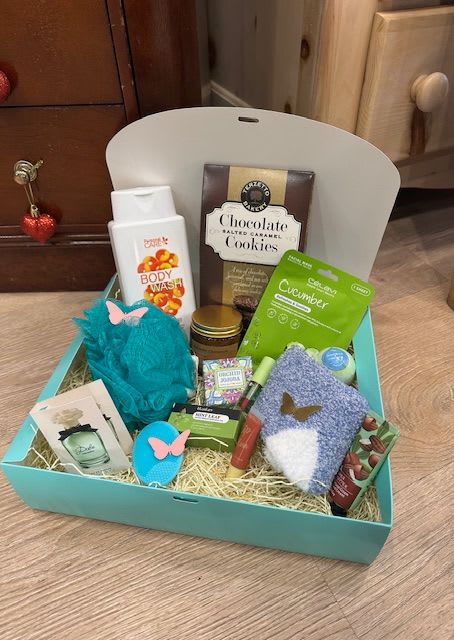 Indulge &amp; Pamper Box  - We all deserve to relax and recover, treat yourself or your loved ones with this gift box!  What's Included: -Exfoliator Pad  -Under Eye Mask  -Box of Cookies  -Perfume Sample Size  -Bath Bomb  -Hand Lotion -Pair of Socks -Loofa    -Large Candle -Body Wash  -Bar Soap -Essential Oil  -Lip Oil  This item can be can locally delivered or shipped anywhere in the USA, please call us to inquire for shipping cost.  Please let us know if you have any dietary issues so we can replace items accordingly.  *Products in boxes may very due to availably*  