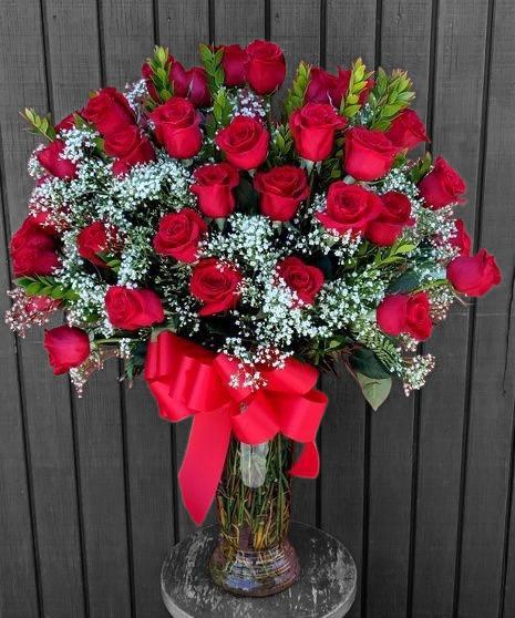 Three Dozen  - 36 Long stem roses with baby breathe and assorted greenery on a premium glass vase.