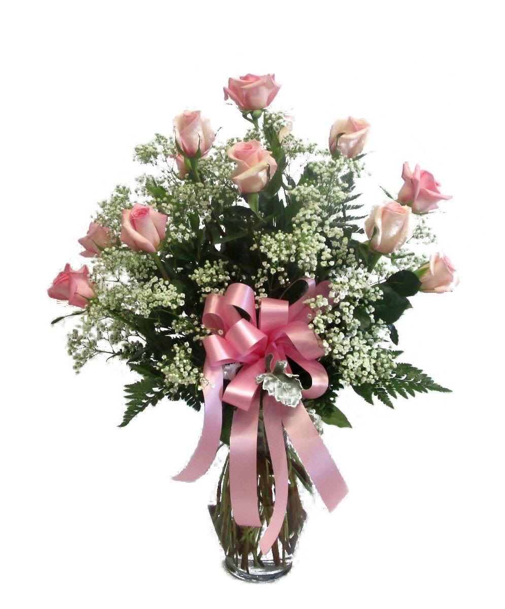 Pink Roses Bouquet - A dozen of the finest Ecuadorian Roses are carefully hand- selected and arranged. Their natural beauty can be seen and enhanced by a beautiful glass vase. (The shade of pink may change according to availability).