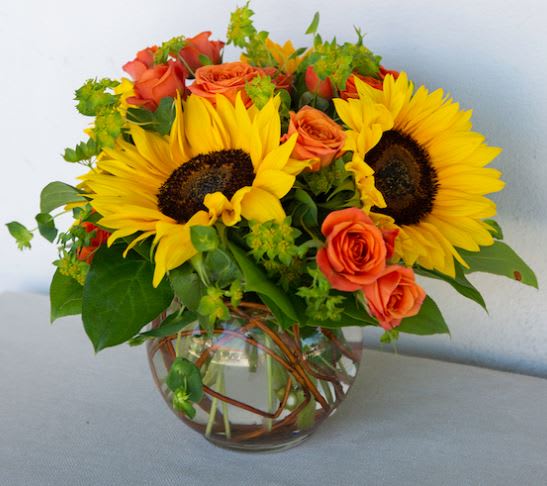 Sunsational Summer - This Sunsational Summer sunflowers bouquet brings the sunshine inside and makes every day feel like summertime! Sunny sunflowers and orange spray roses make this a delightful way to say “Have A Sunny Day!”