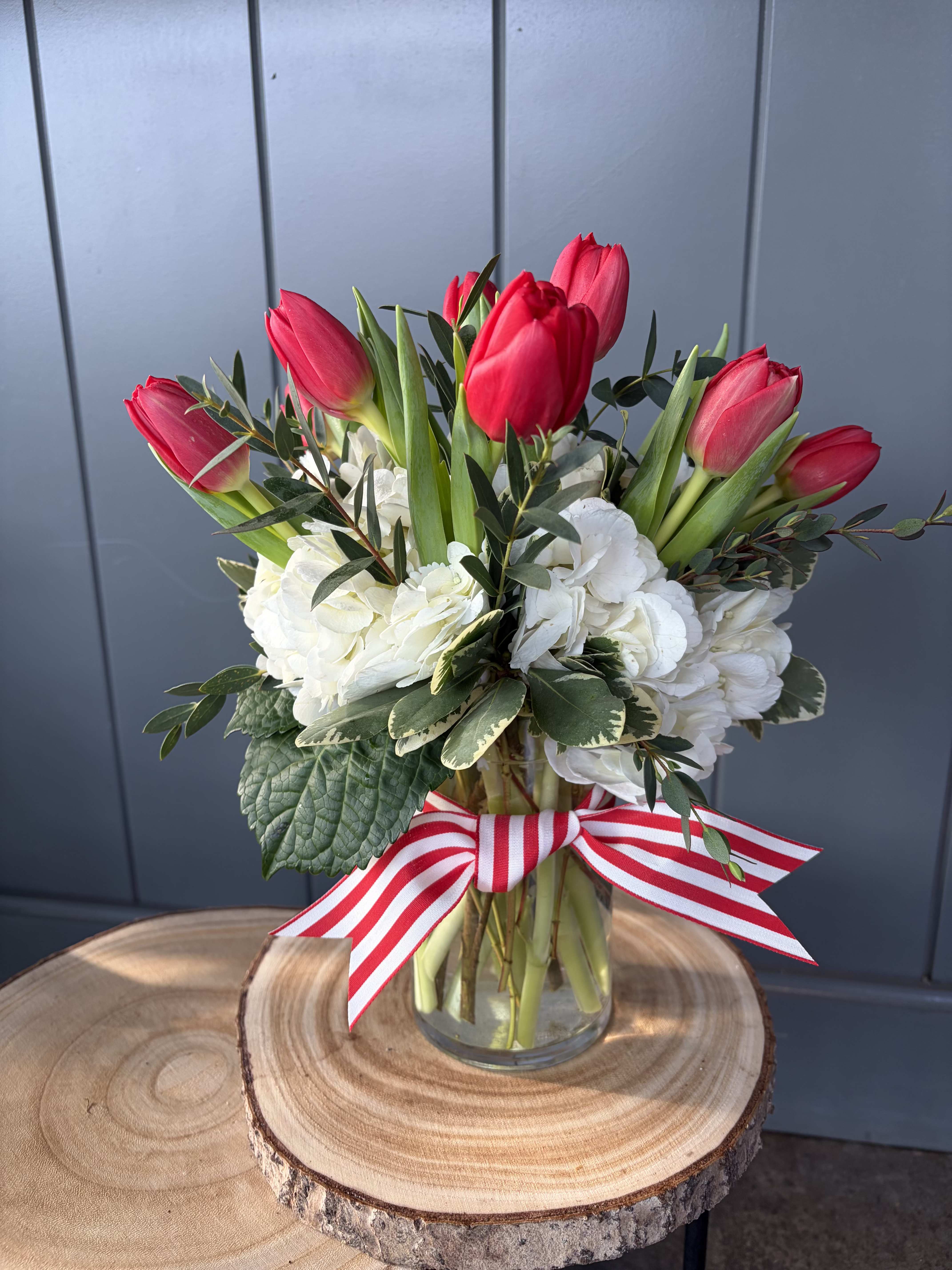 Cutie - 10 tulips with white hydrangea.