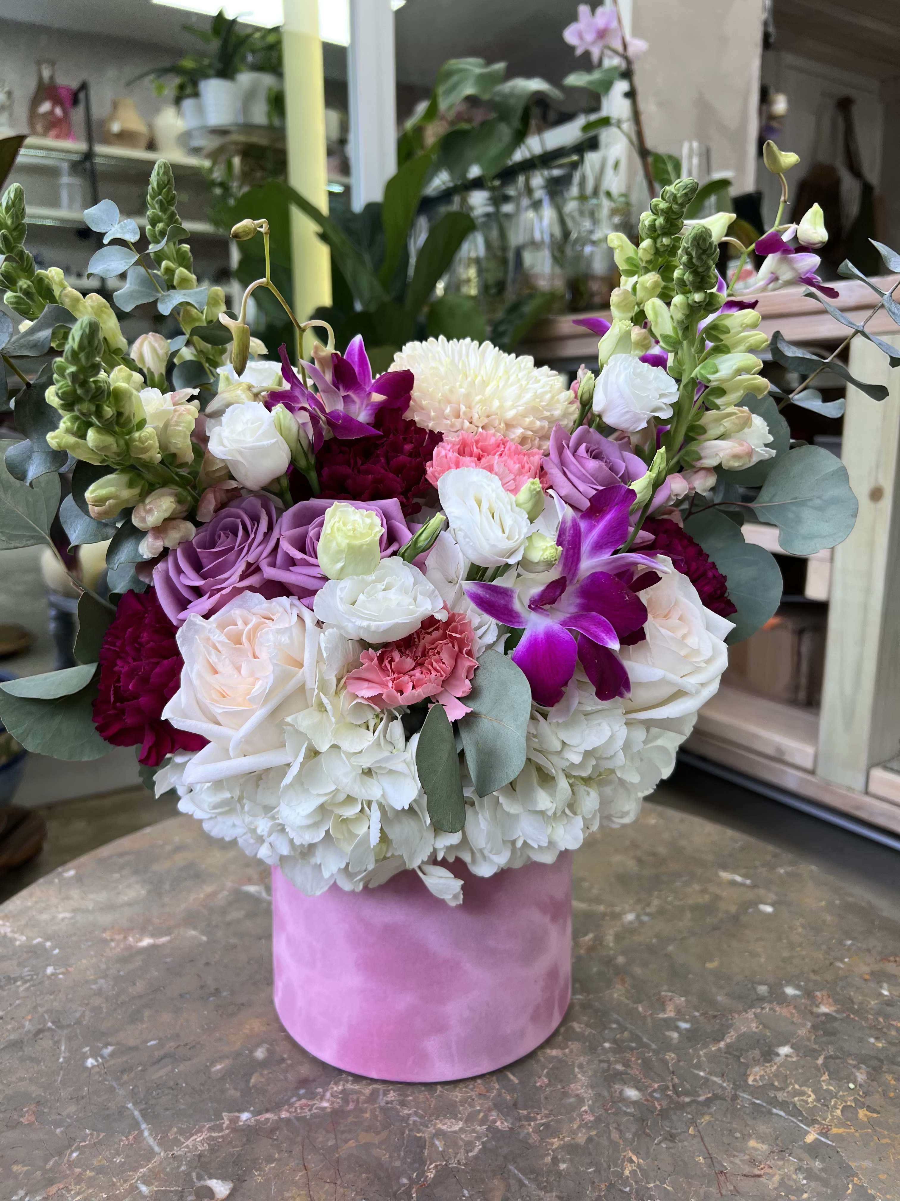 Orchid Dream  - Blush tones, velvet dreams, and orchids that steal the show. A soft blend of hydrangeas, roses, and lisianthus-perfect for any "just because" moment. 
