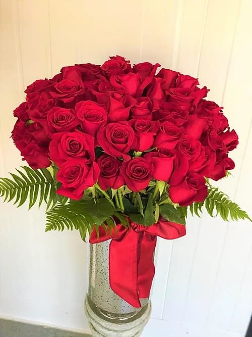 100 Roses Bouquet - The "100 Roses Bouquet", is a gorgeous floral arrangement set in a nice glass vase. That's the perfect "Buch of love" roses to celebrate Valentine's Day. 27"H x 20"W approx. Click next to see more.  