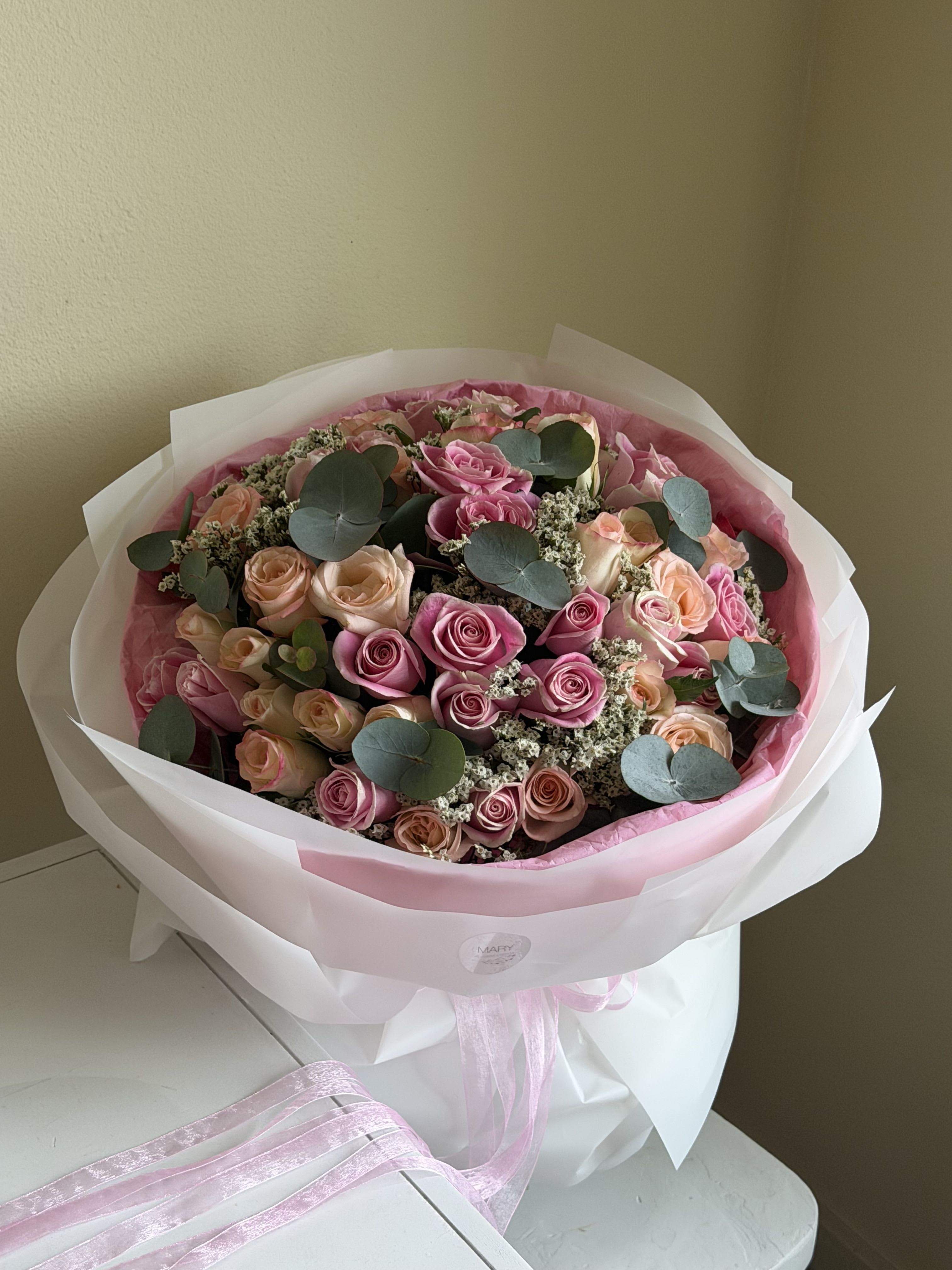 Bouquet of pink and cream roses - Celebrate life’s special moments with this exquisite bouquet of pink and cream roses. Soft, romantic pink roses blend beautifully with the gentle cream tones, creating a harmonious and elegant arrangement. Perfect for birthdays, anniversaries, or just to brighten someone’s day, this bouquet conveys love, gratitude, and warmth. Each rose is carefully hand-selected and arranged by our expert florists to ensure freshness, beauty, and a lasting impression. Make every occasion unforgettable with this timeless floral gift. 