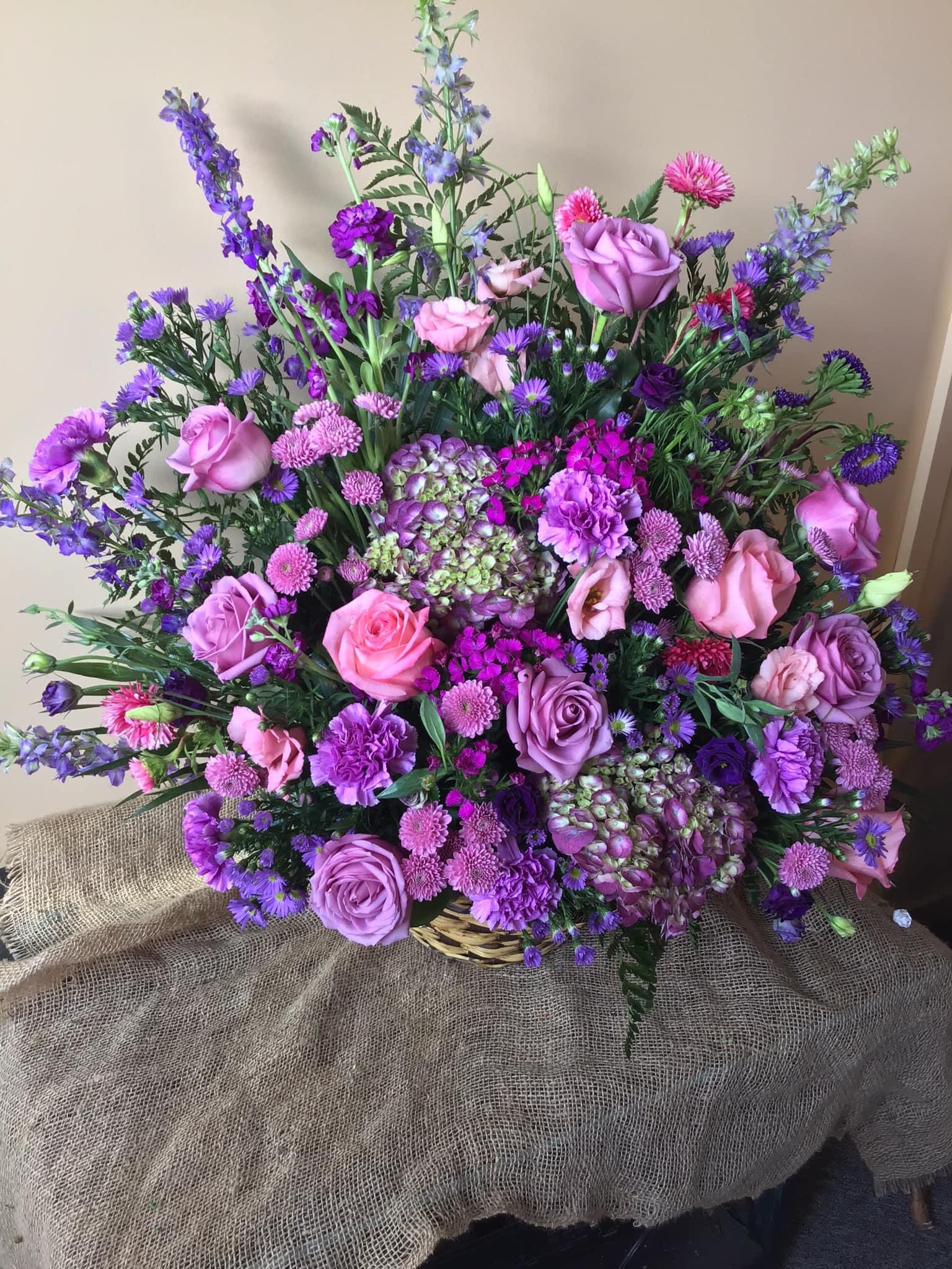 Purple Sympathy Basket - Traditional sympathy basket filled with shades of purples.