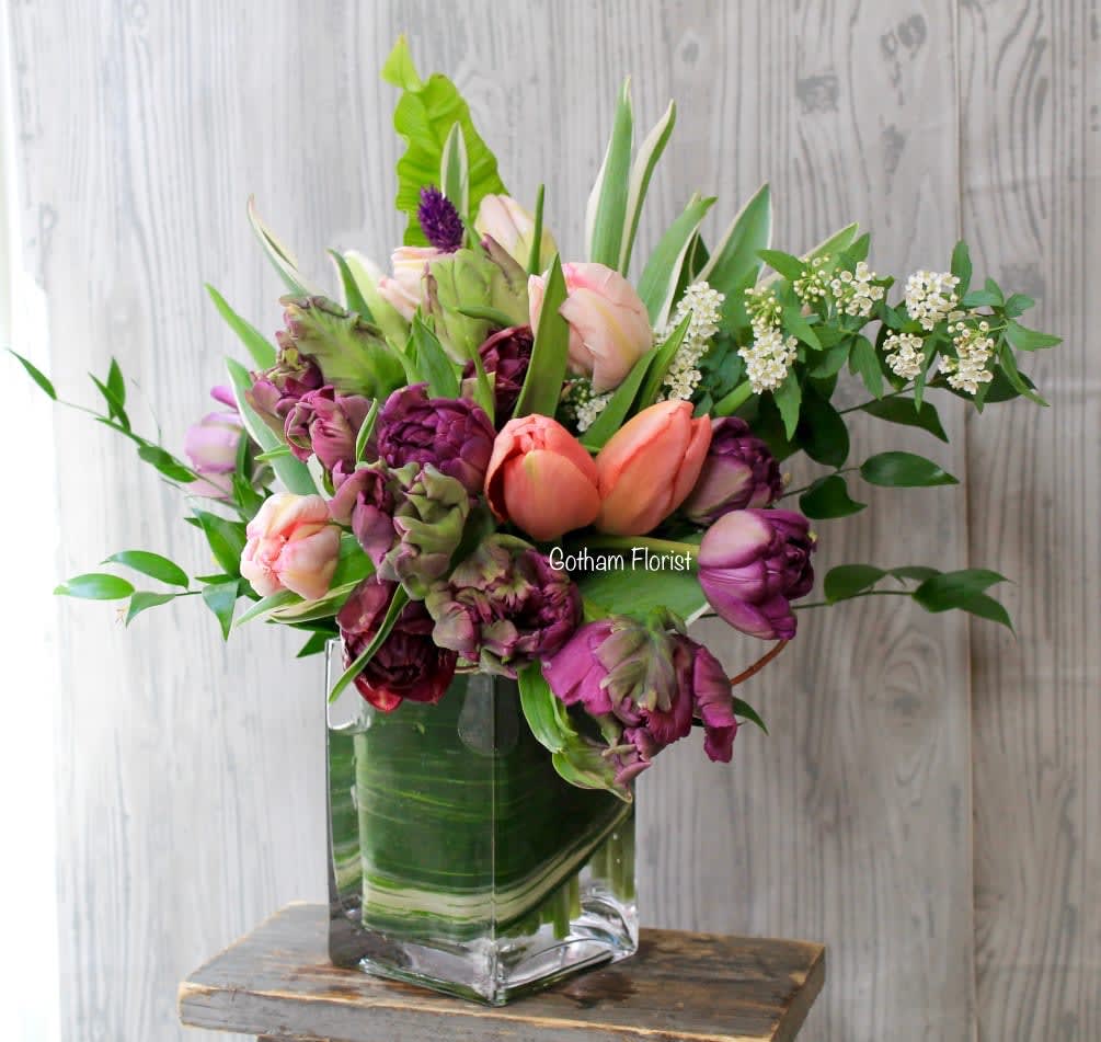 Tulip Heaven - 20 mixed tulips in clear glass vase. Colors may vary with availability. Spring is here. Brightens someones day with fresh colorful tulips from the best local florist in new york.