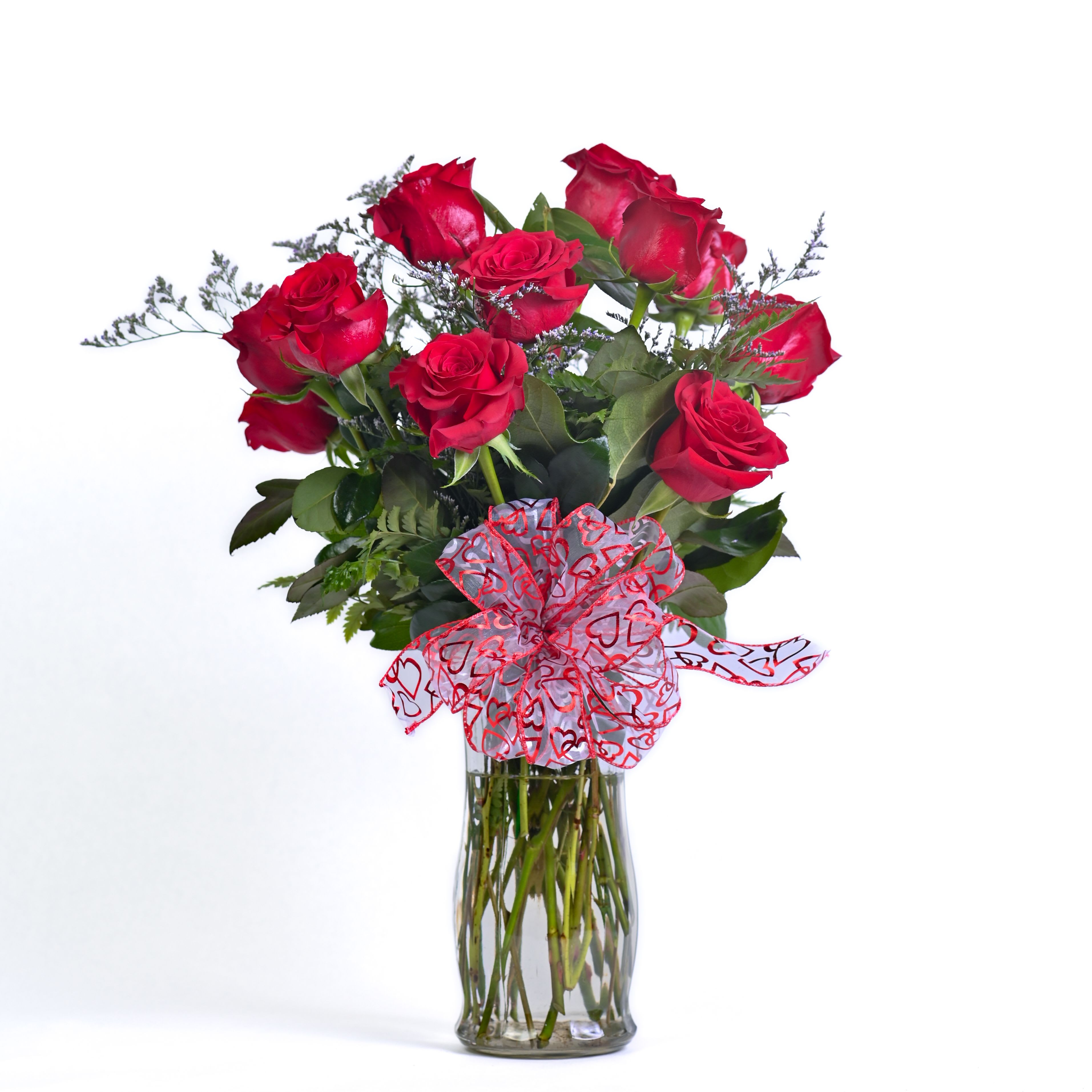 Dozen Roses - A stunning dozen red roses, artfully arranged with lush greenery and soft filler blooms- an elegant, timeless gift that speaks straight from the heart. Available in three distinct sizes and styles- Standard, Hyped up, and All That- so you can choose the perfect level of wow for your special occasion.