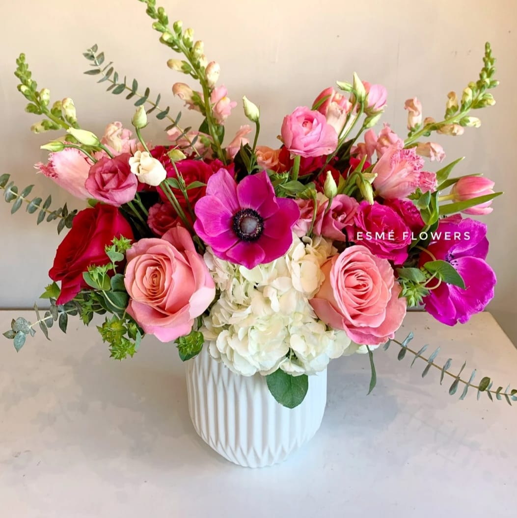 Cara - An exquisite arrangement for your loved one featuring anemones, premium hermosa roses, Italian ranunculus, hydrangeas, lisianthus and other seasonal blooms in a beautiful ribbed ceramic vase.   VALENTINE'S DAY COLLECTION - Available 2/5 - 2/21