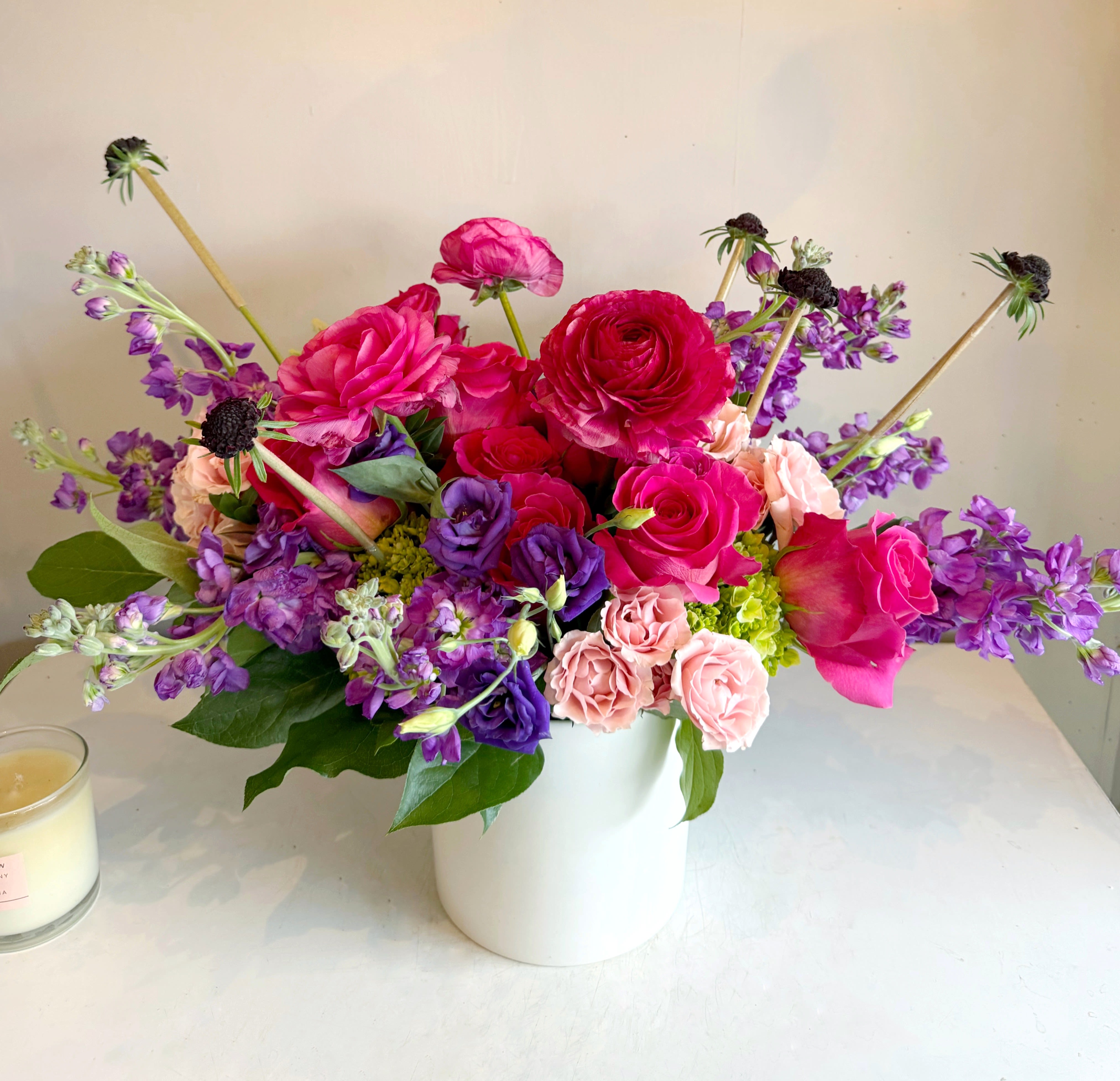 Noir Violet - Bold, flirty, this Valentine’s Day arrangement pairs hot pink and rich purple blooms for a high-energy take on romance—vibrant, modern, and full of attitude. Perfect for big feelings, bold gestures, and love that refuses to be subtle.