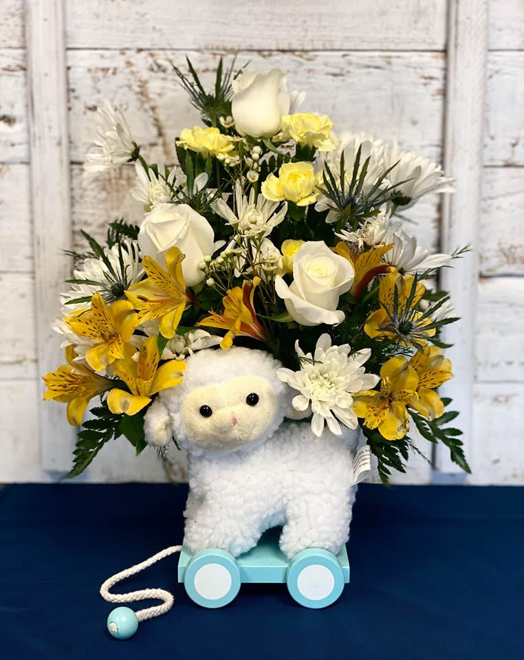 CFB103 - A beautiful mixture of white &amp; yellow flowers arranged in a keepsake wagon container with a plush lamb.