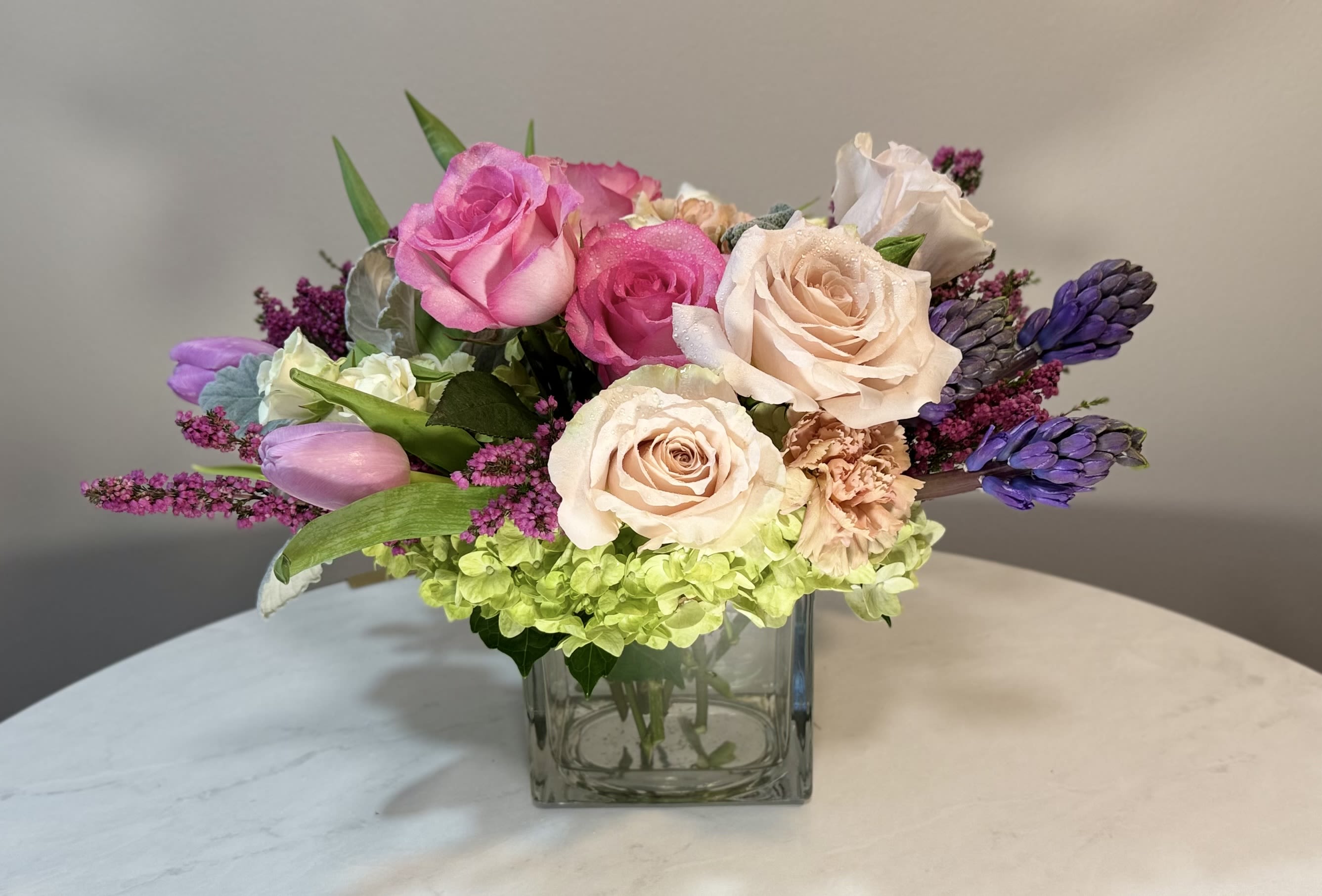 Maria  - Roses and hydrangea and assortment of spring blooming flowers. 5 x 5 vase